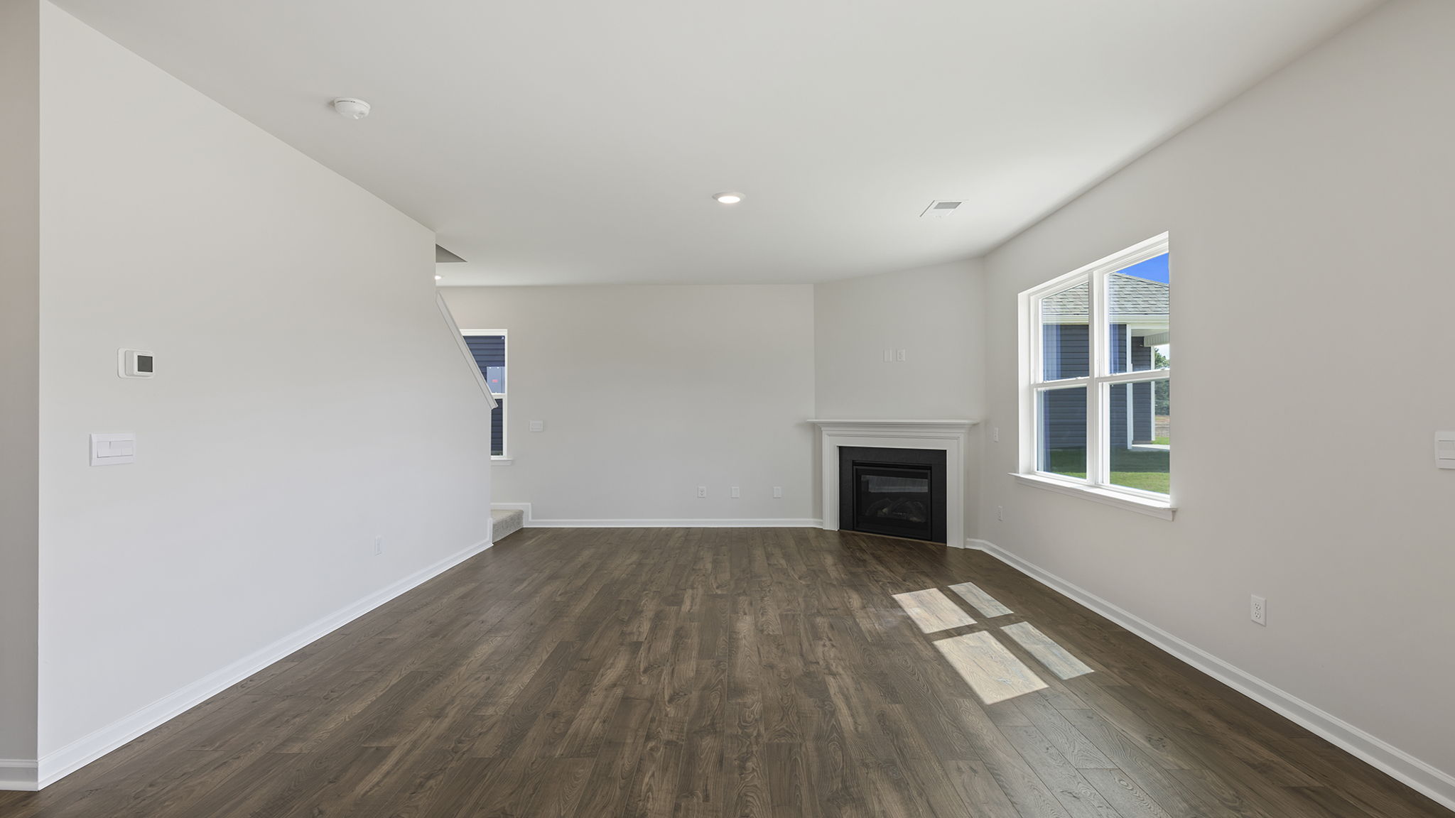 Living room with gas log fireplace.