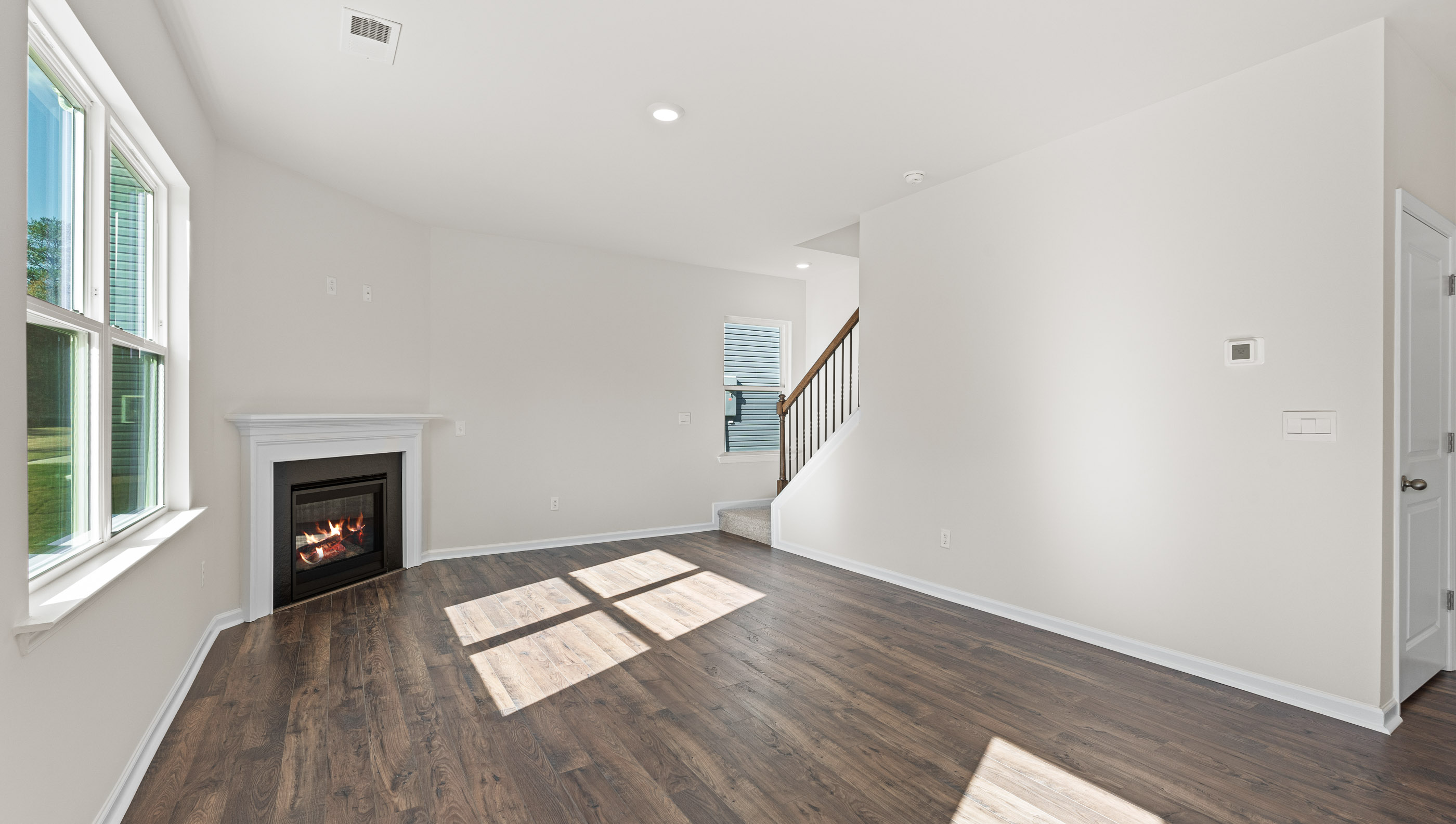 Living area and view of back stairwell.