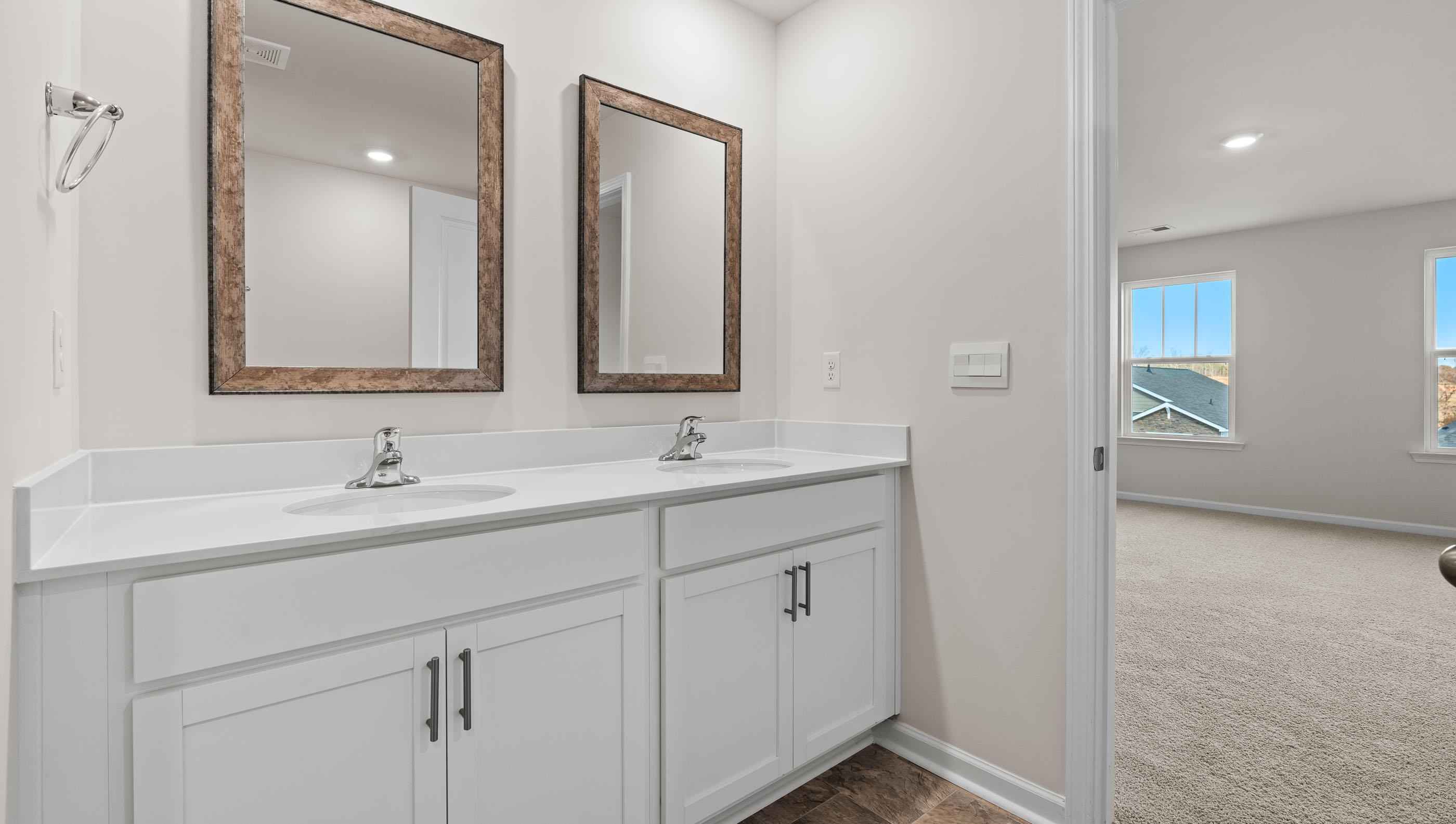 Primary bathroom with dual sink vanity.