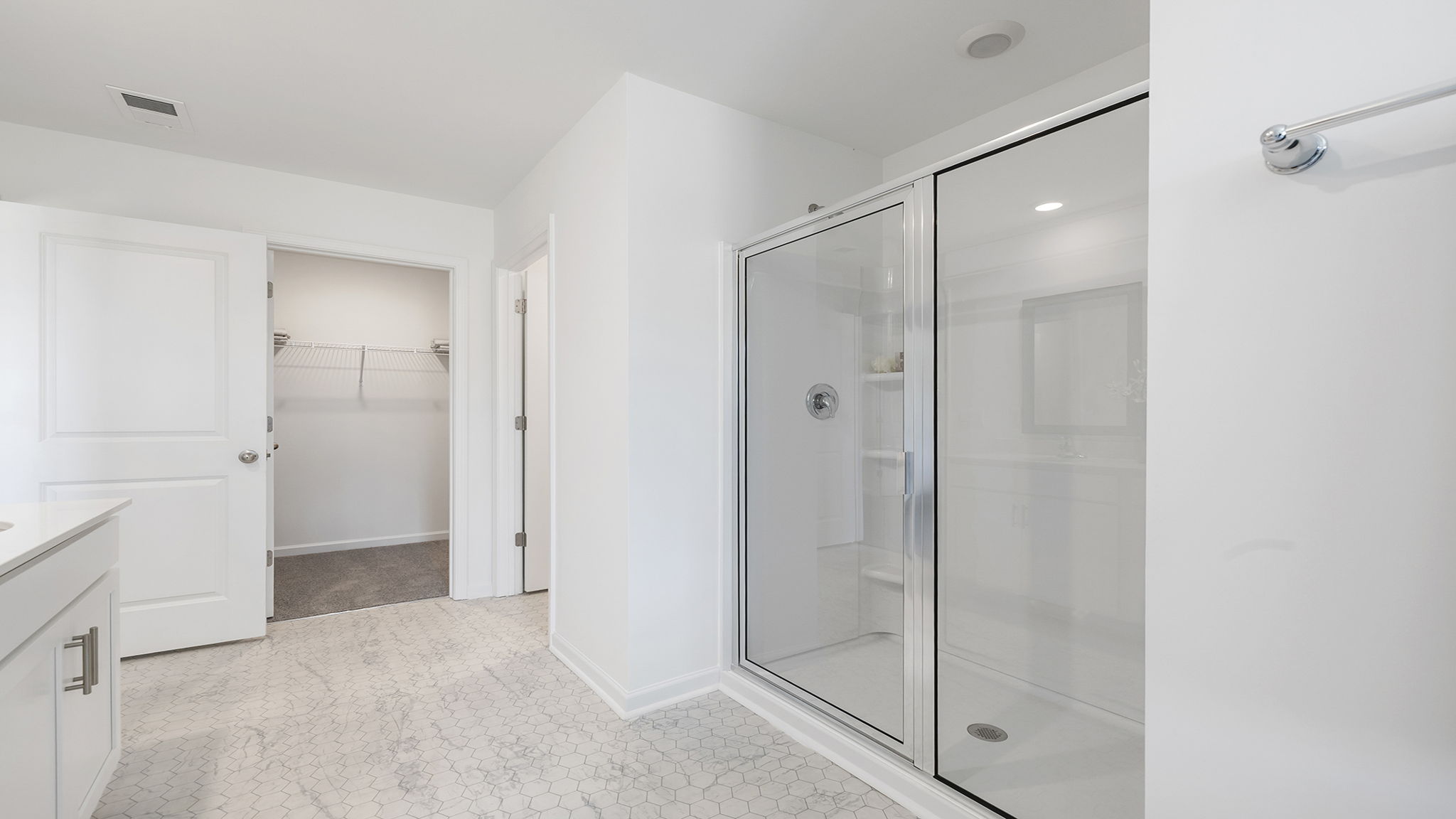 Primary bathroom with double vanity sinks.