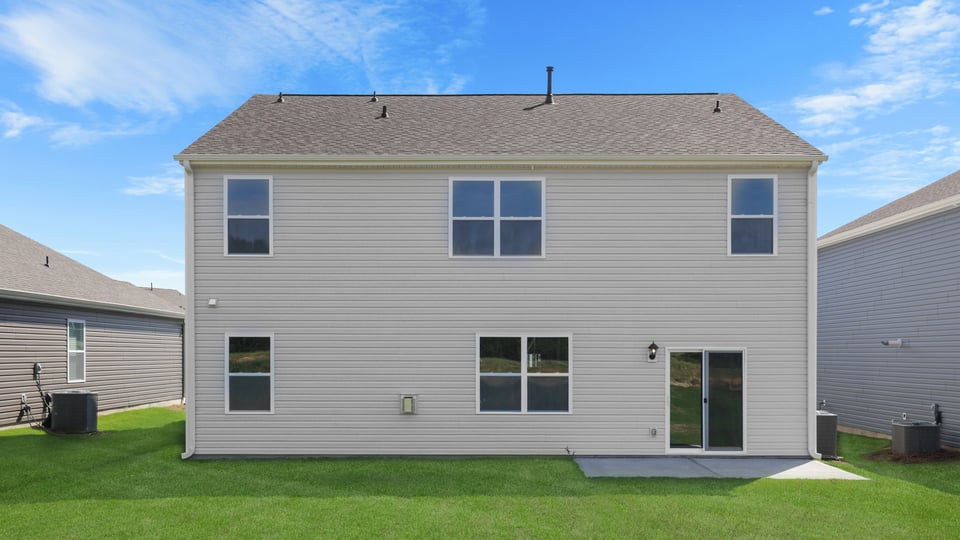 Back exterior with large backyard.