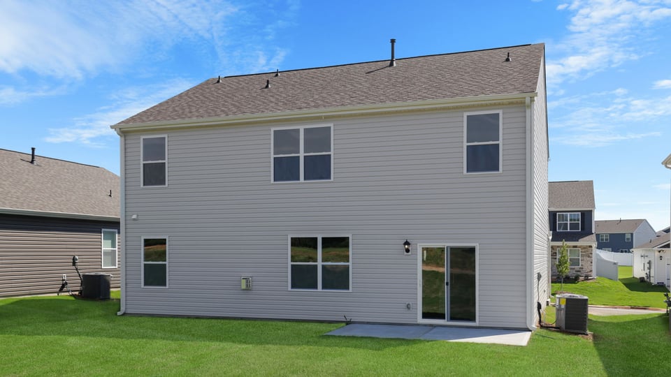 Back exterior with large backyard.