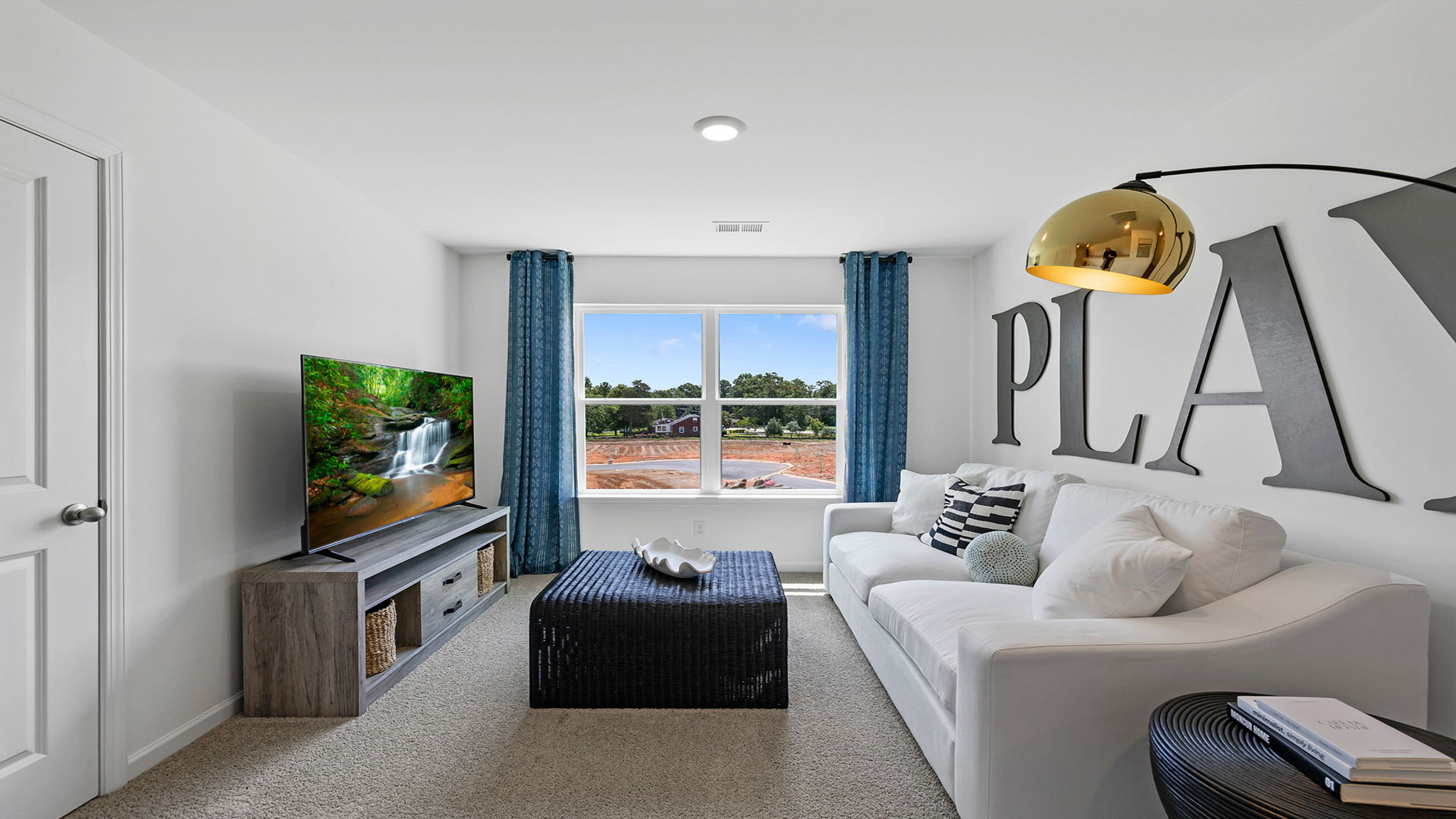 Loft with window and carpet.