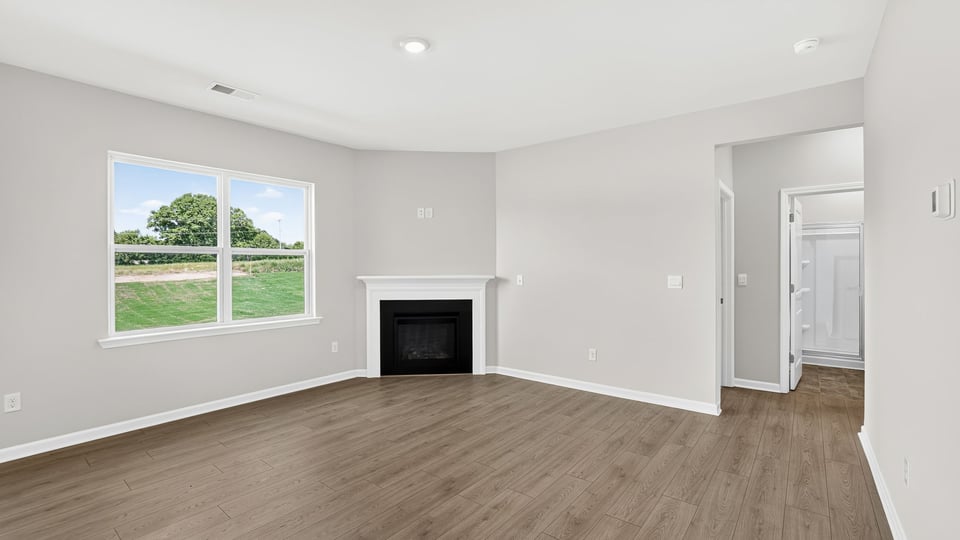 Family room with window and fireplace.