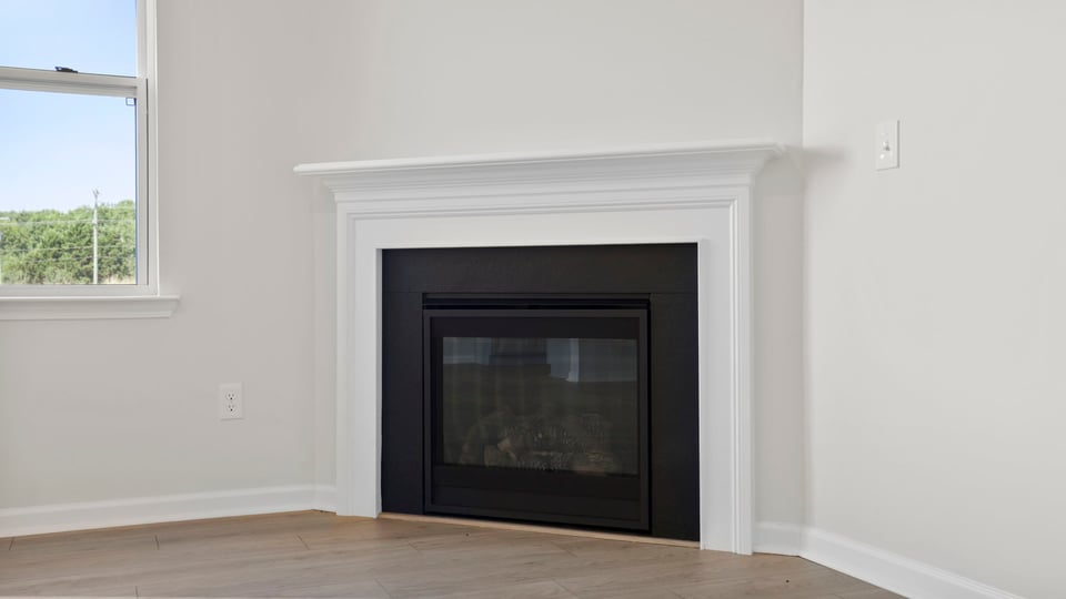 Family room with window and fireplace.