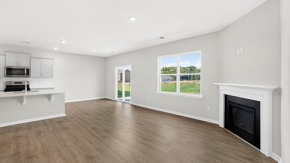 Family room with window and fireplace.