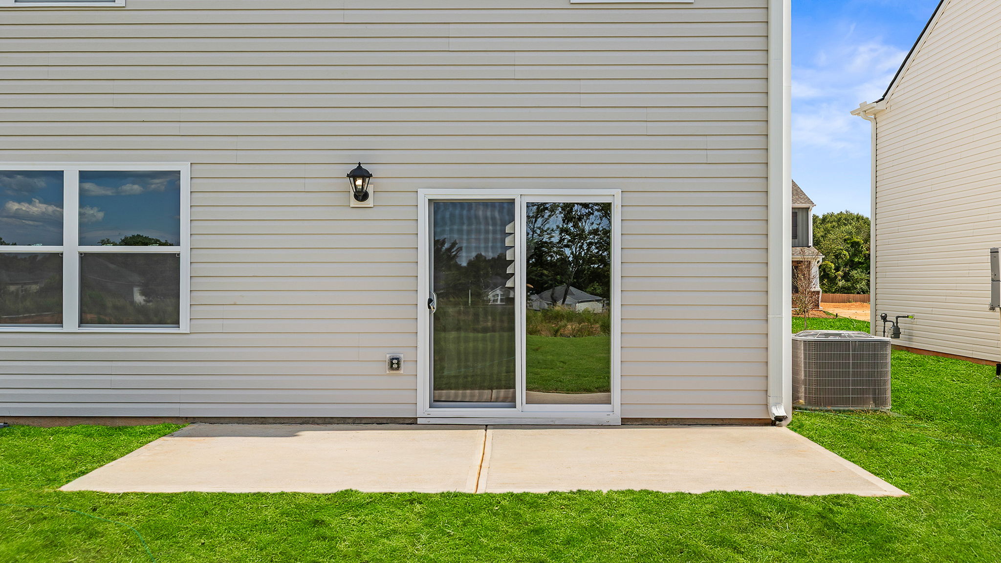 Back exterior with large backyard.