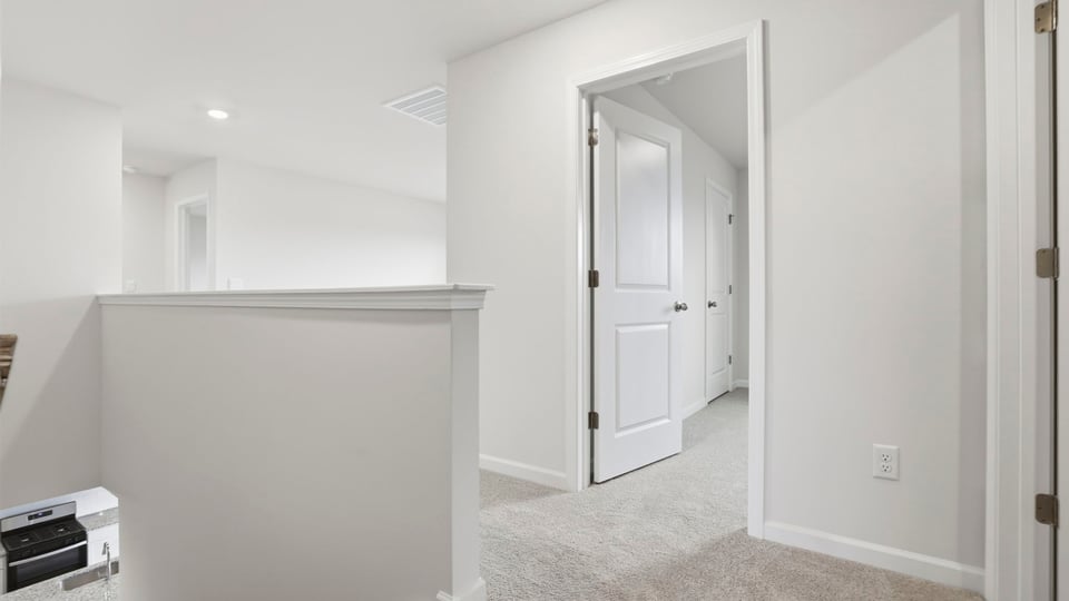 Upper level landing and view of hallway.