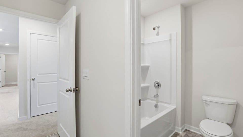 Hal bathroom with combinations shower / tub.