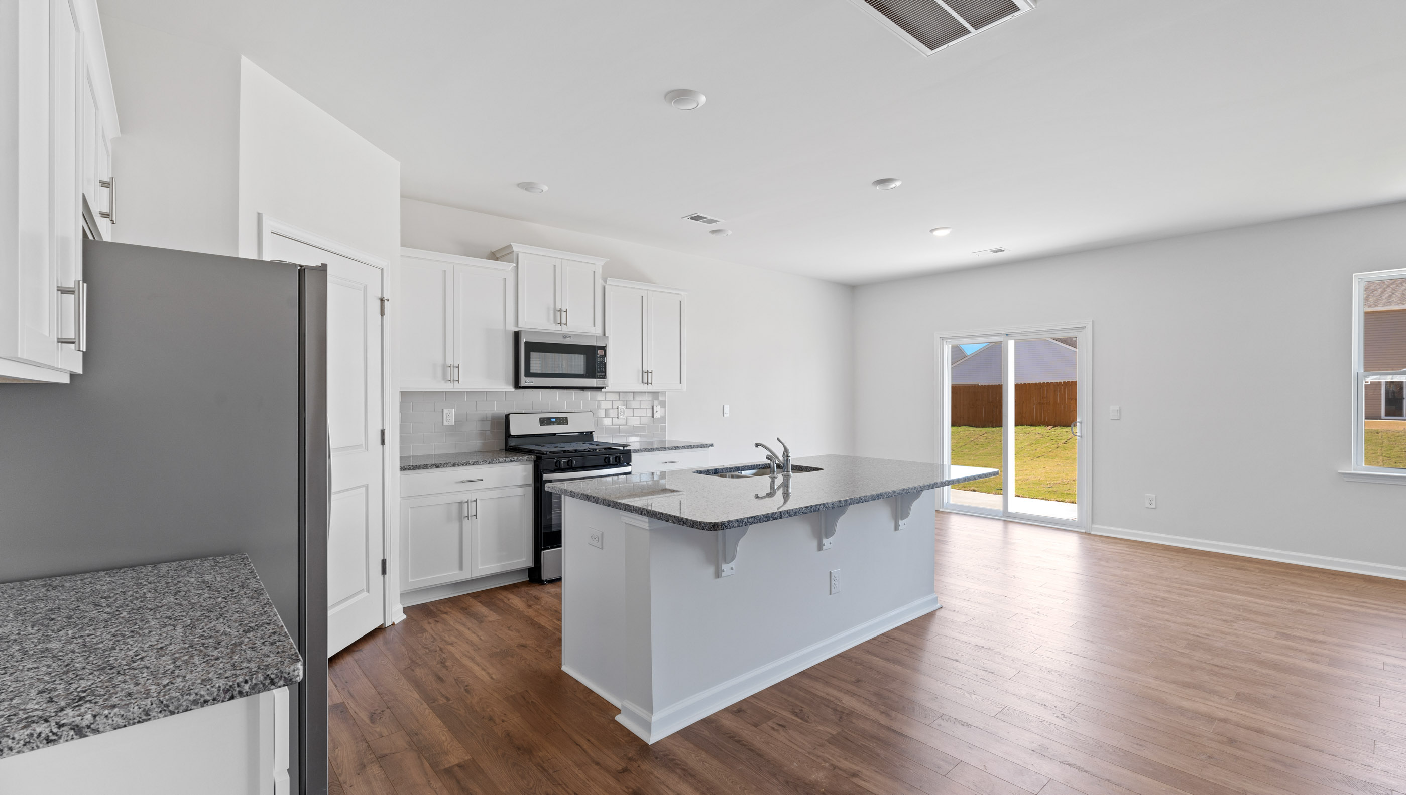 View of kitchen and dining area.