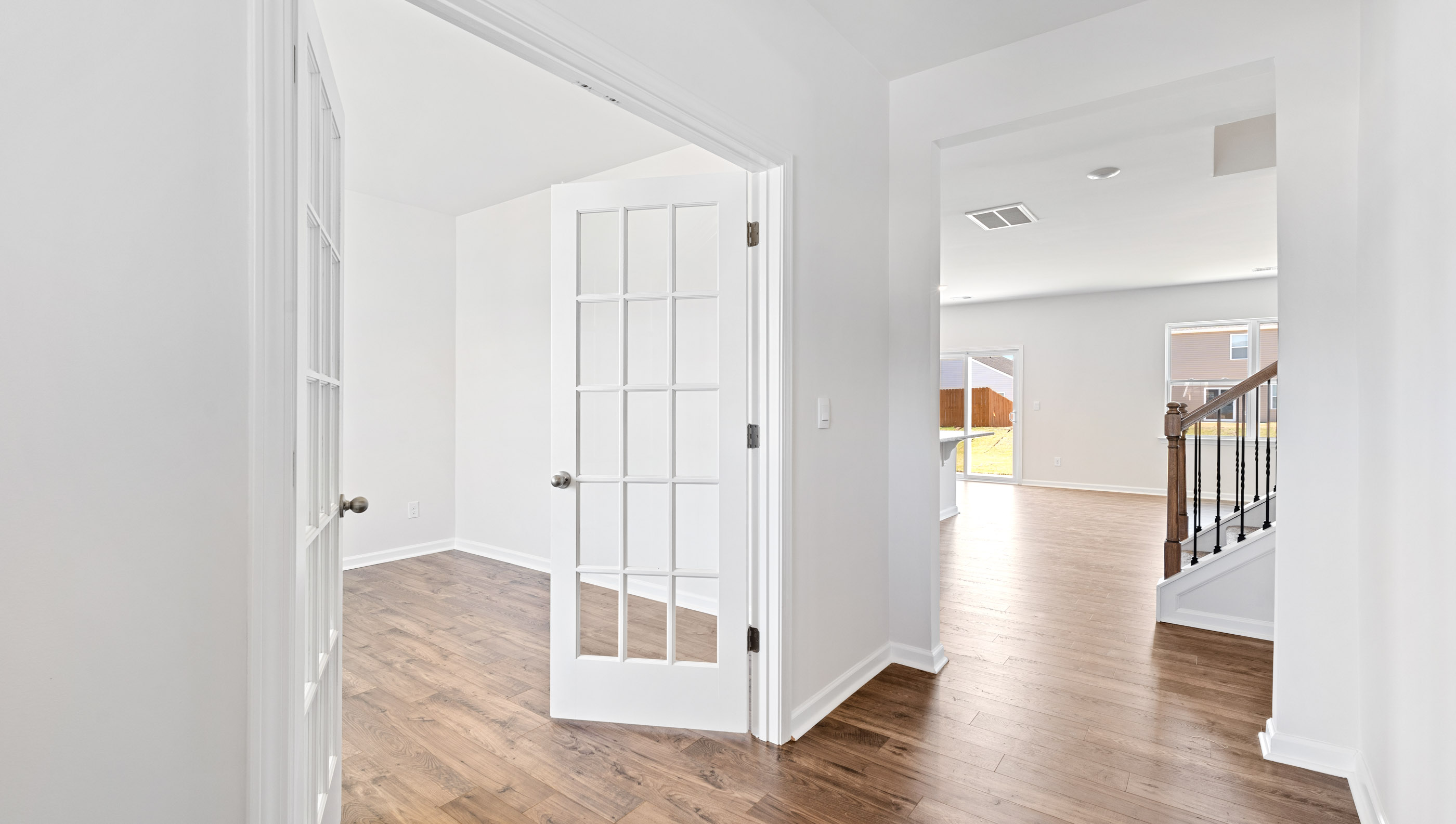 View of hallway to the living area and study at front of home.