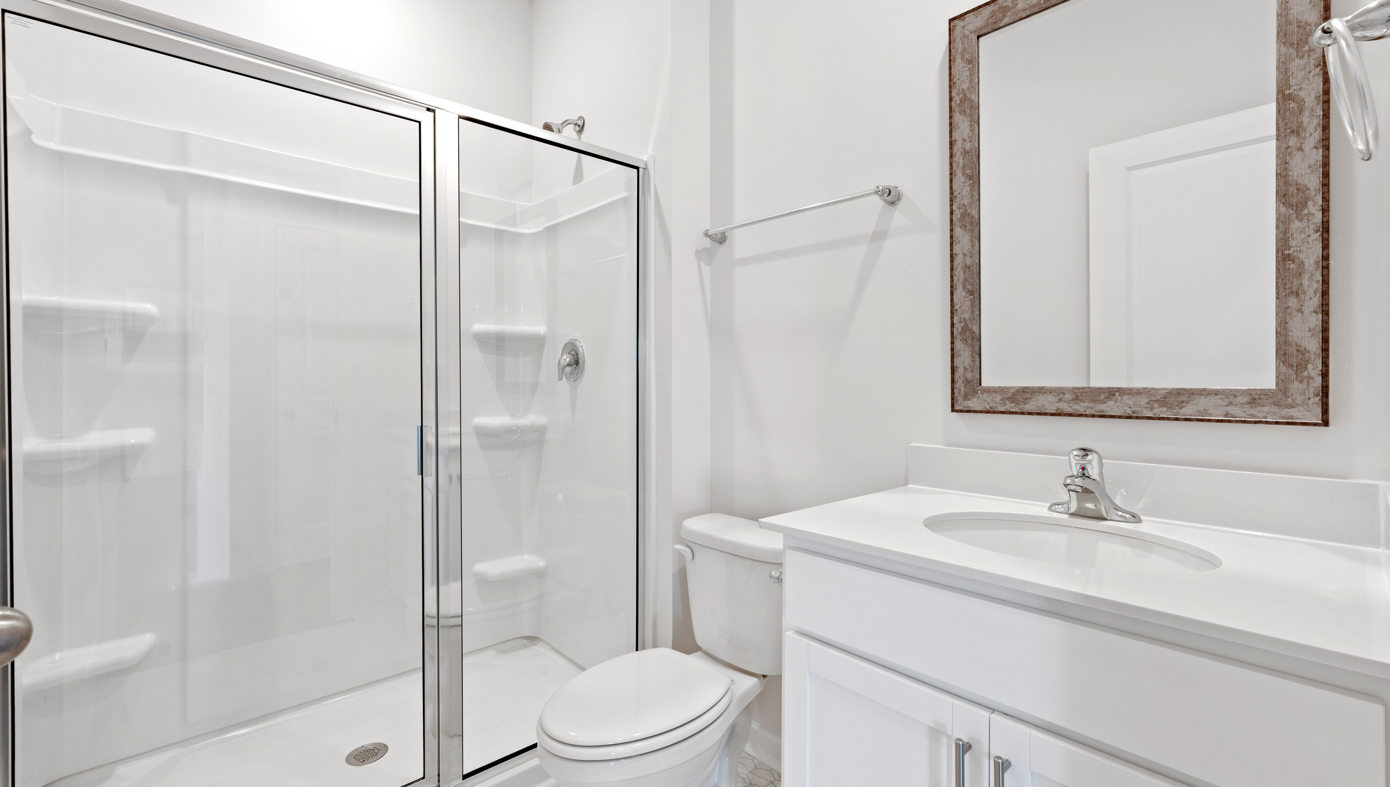 Full bath with vanity and combination shower / tub on main level.