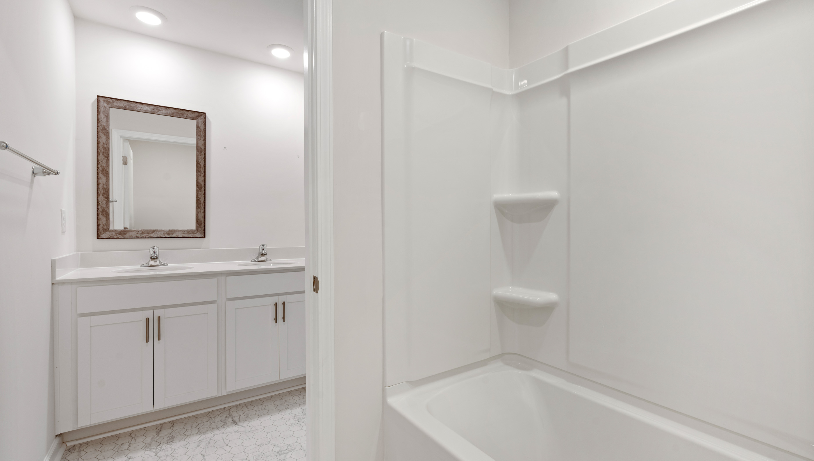 Separate shower area with combination shower / tub and toilet.