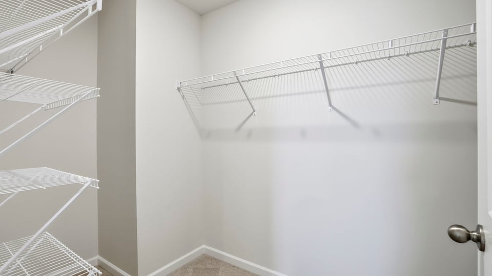 Primary bedroom walk-in closet.