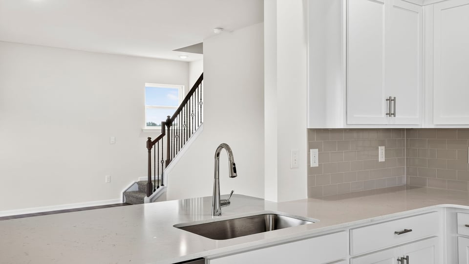 Kitchen with island and cabinets.