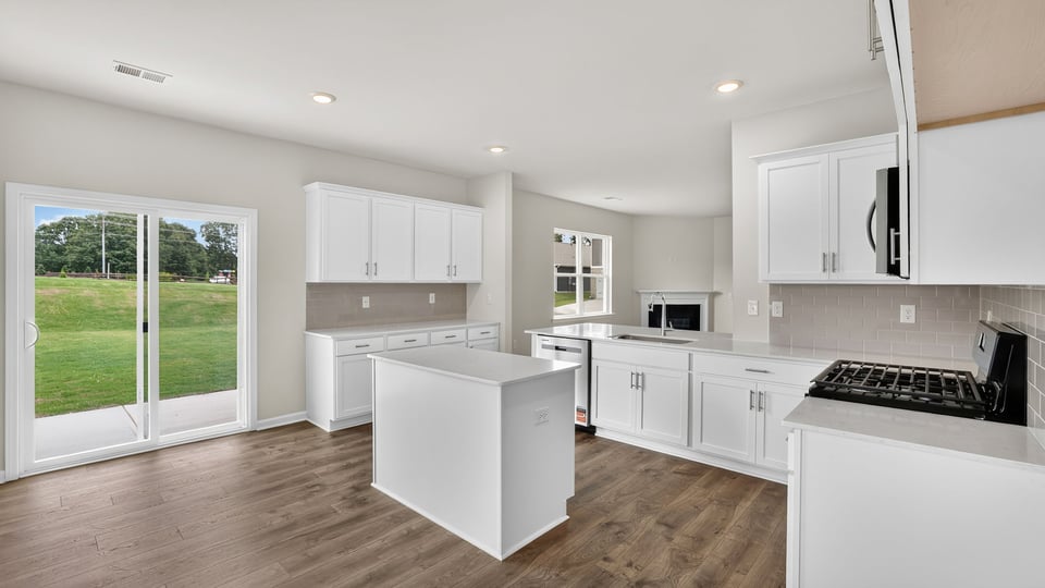 Kitchen with island and cabinets.