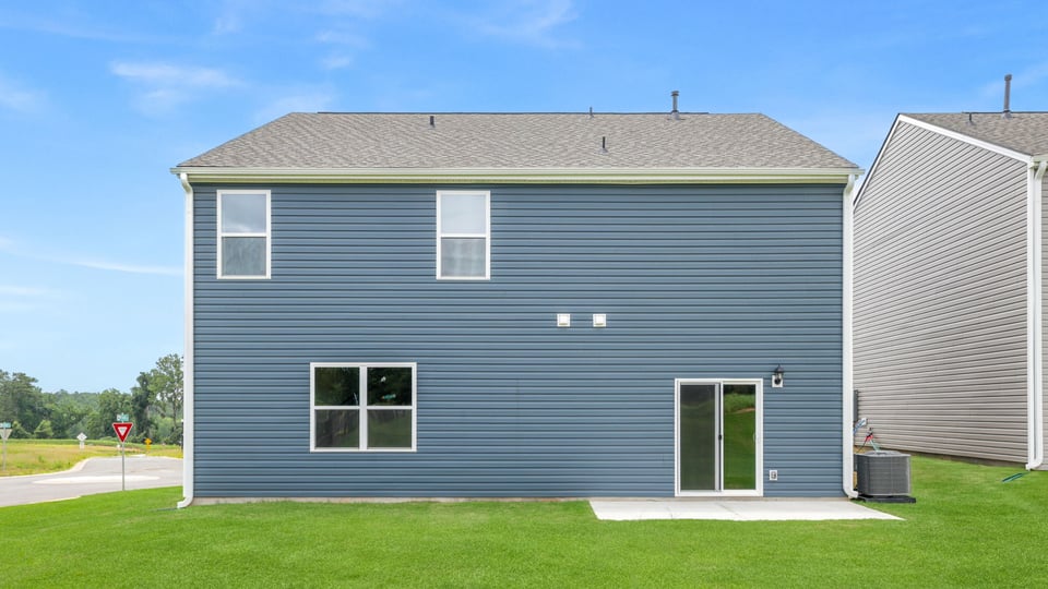 Back exterior with large backyard.
