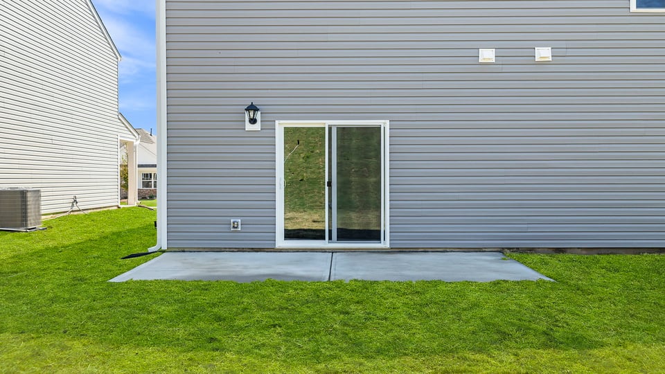 Back exterior with patio.