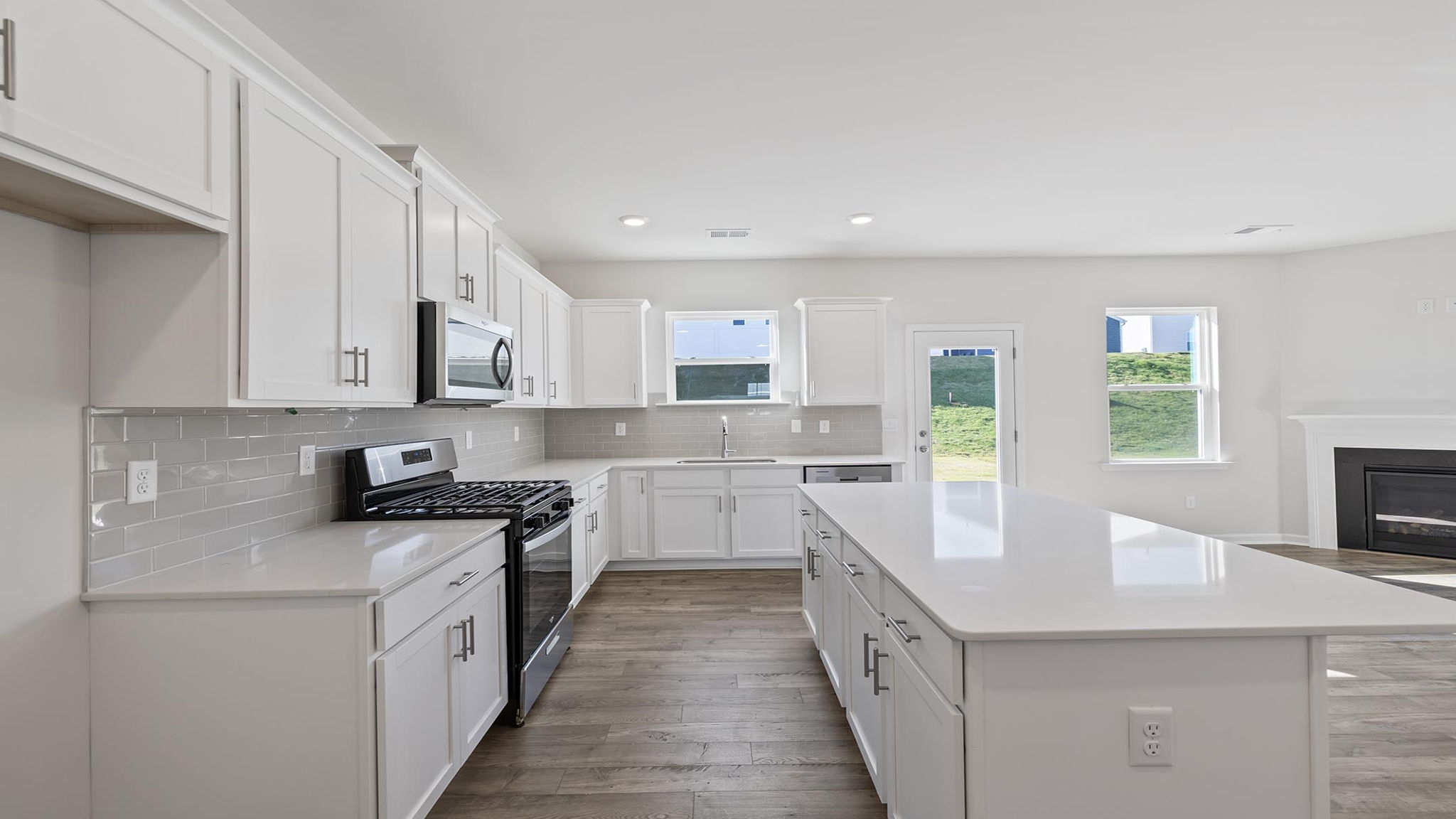 Kitchen with island and cabinets.