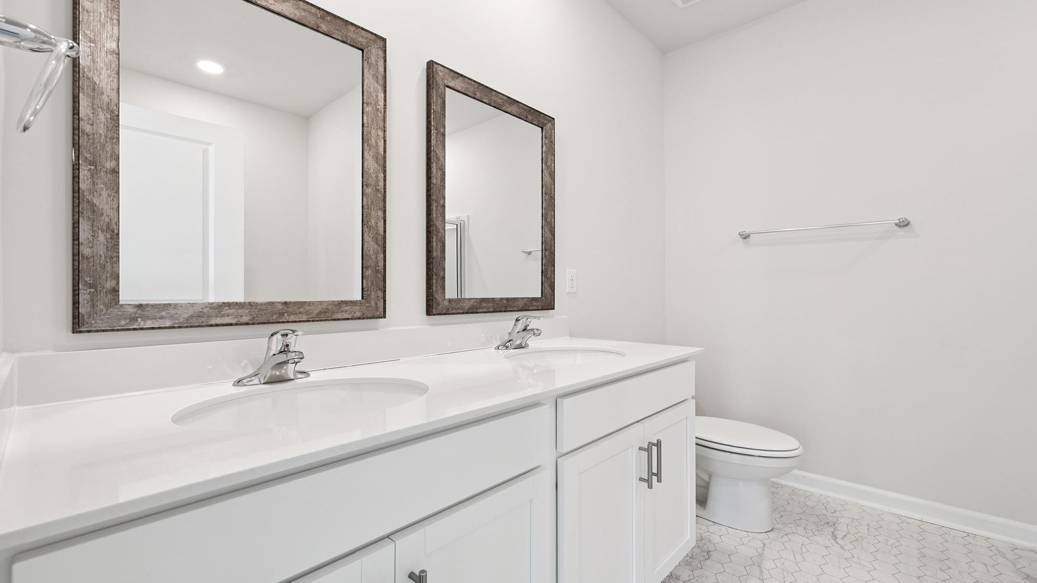 Bathroom with double vanity sinks.
