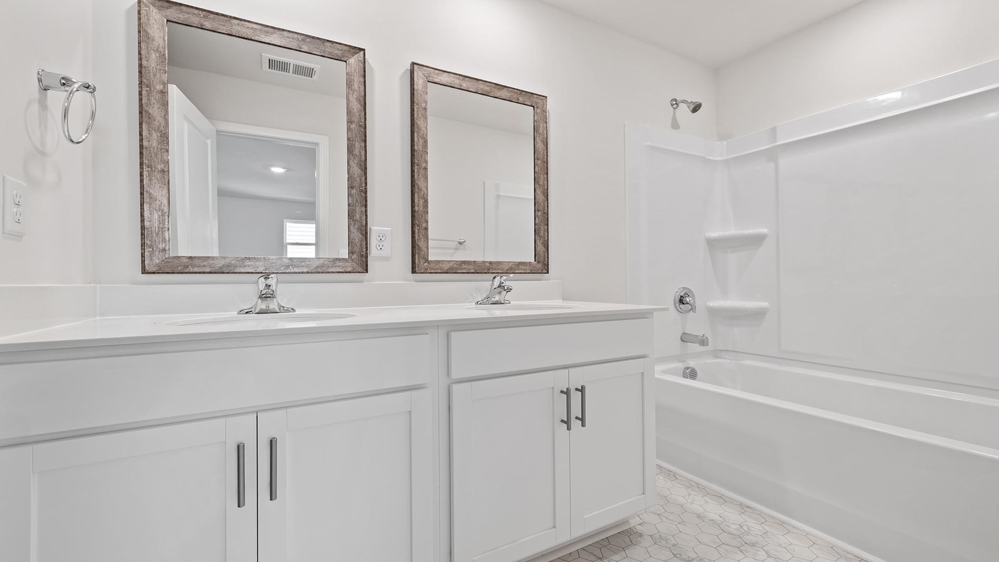 Primary bathroom with double vanity sinks.