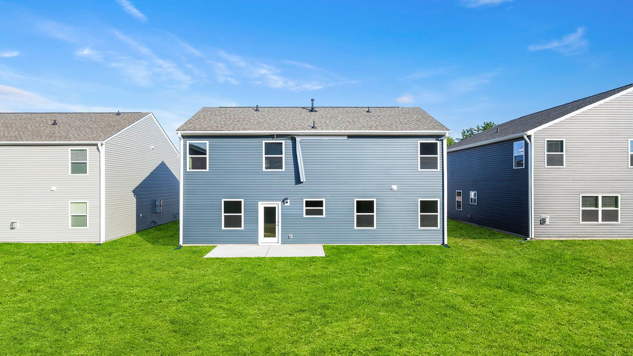 Back exterior with large backyard.