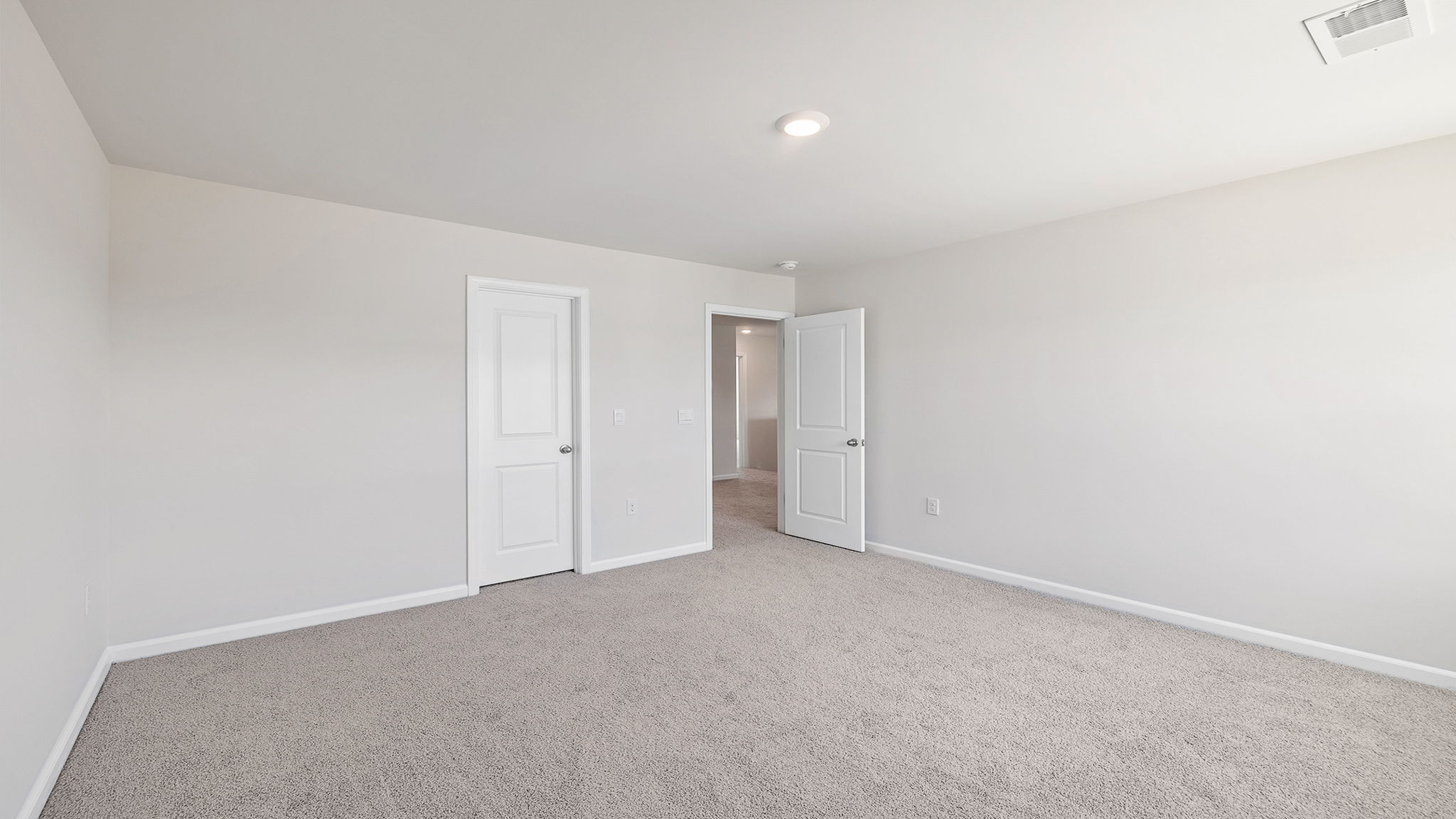 Bedroom with carpet and windows,