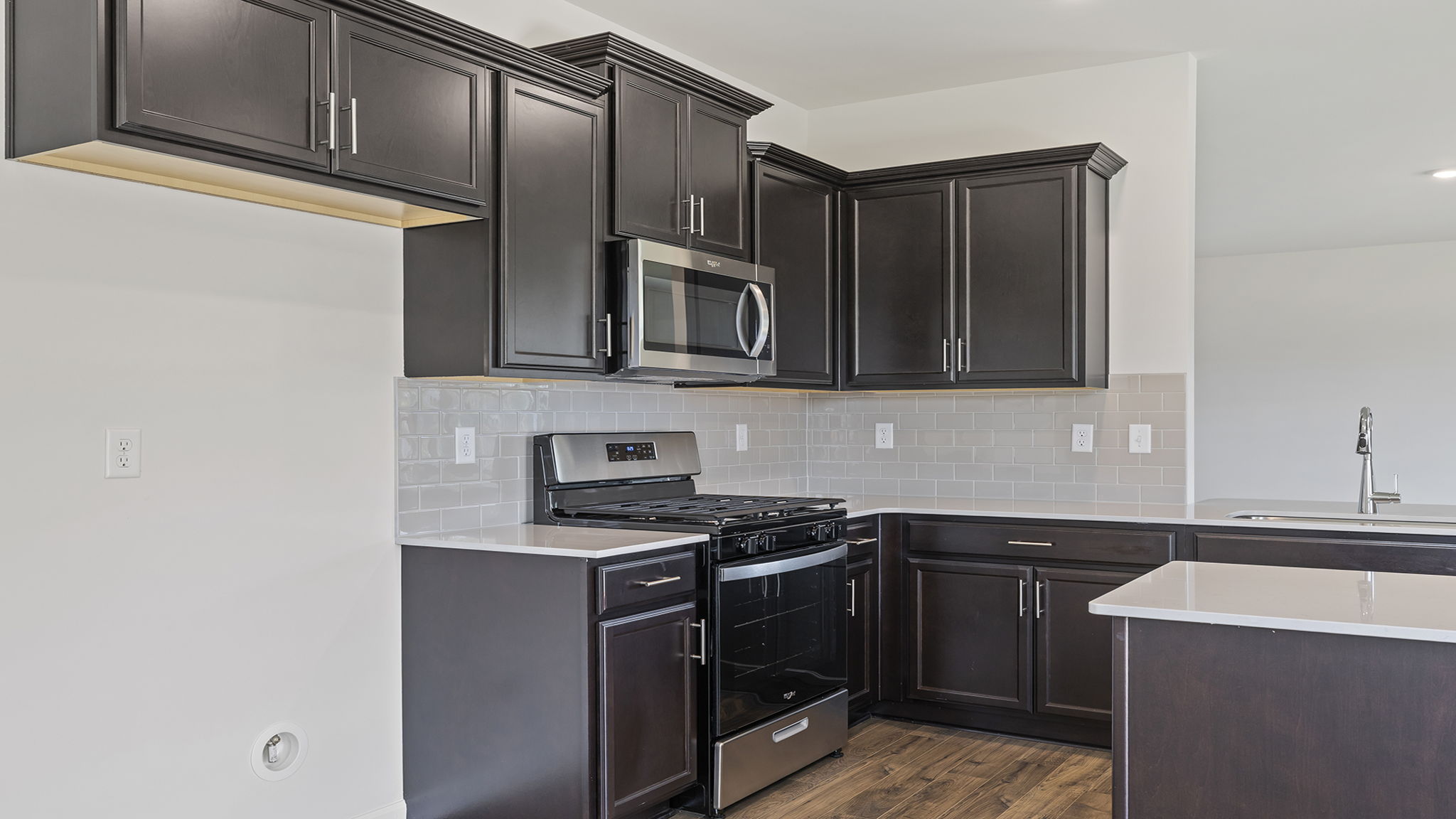 Darker cabinets are very modern.