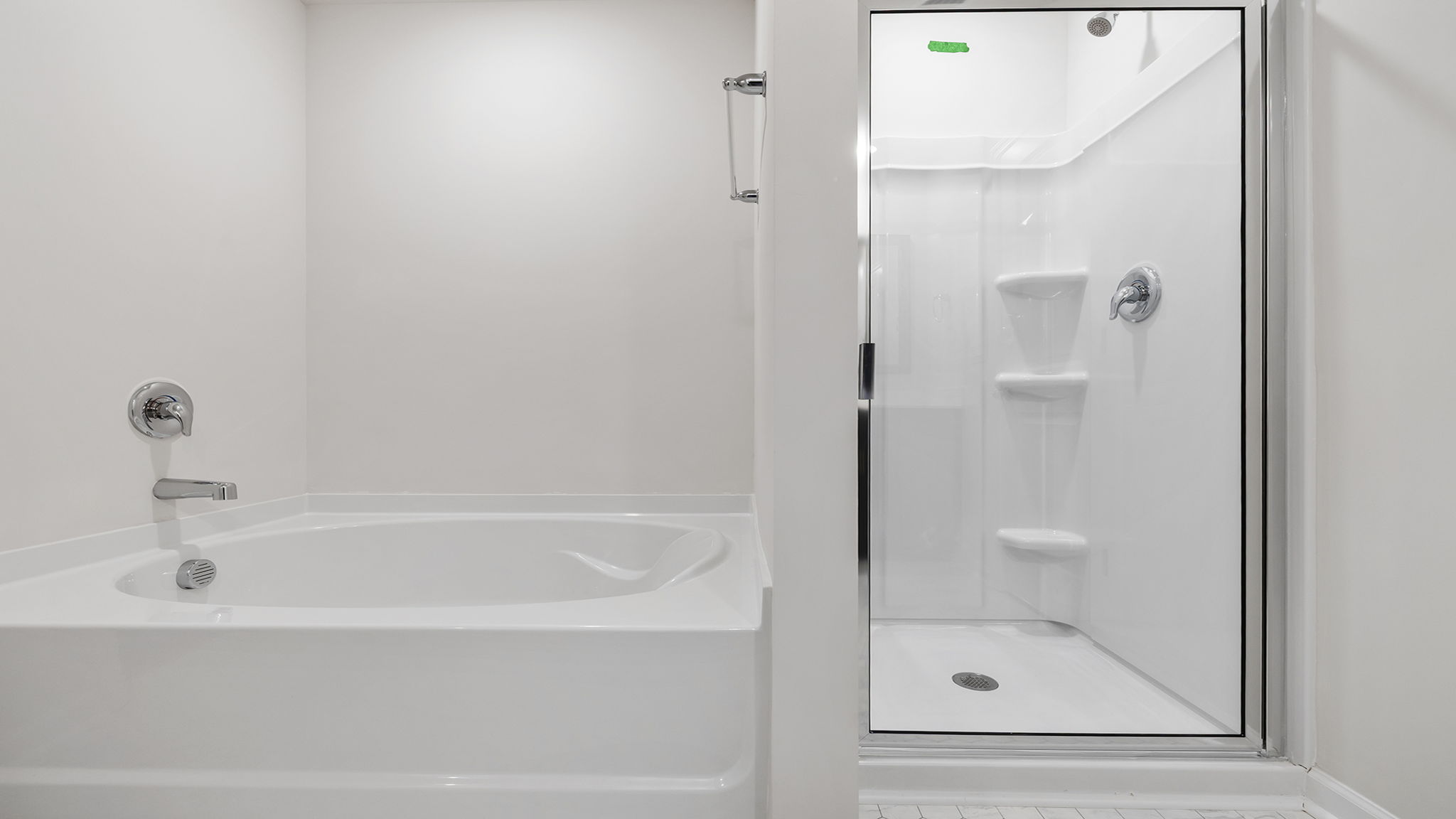 Primary bathroom with garden tub and walk-in shower.