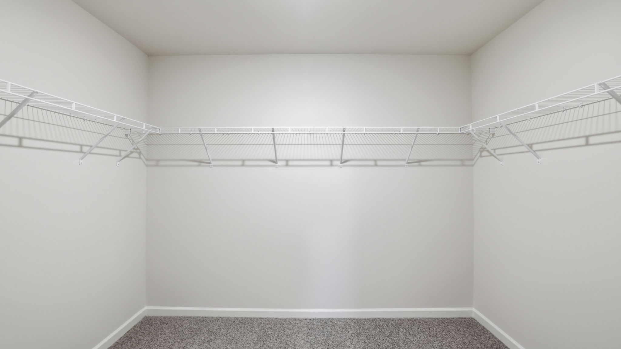 Primary bedroom walk-in closet.