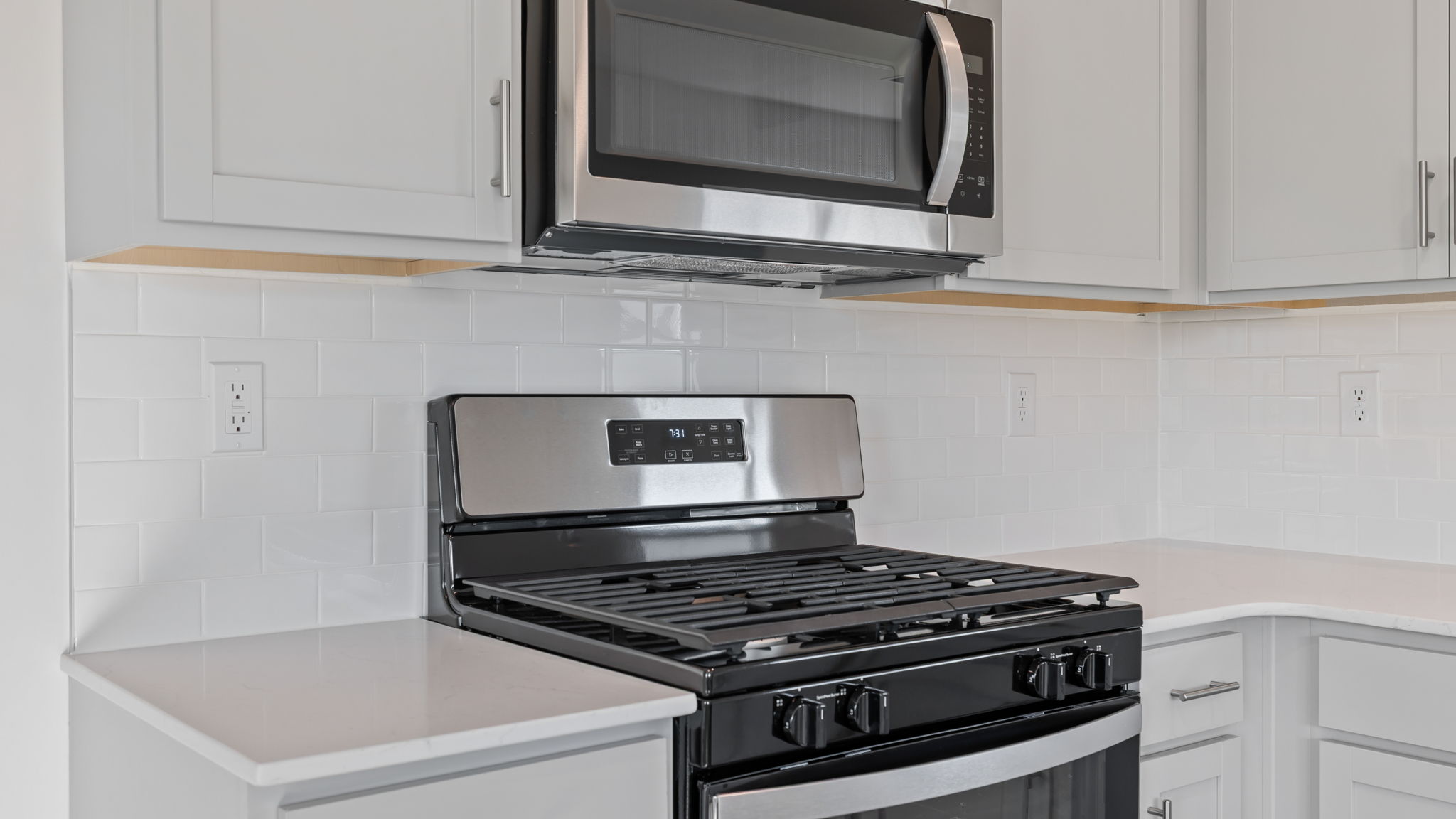 Kitchen features stainless steel appliances.