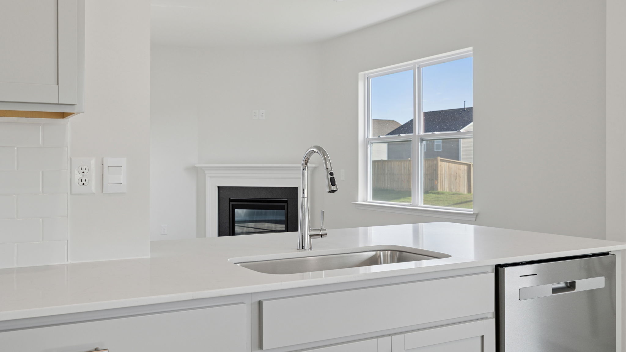 Island hosts sink and dishwasher.