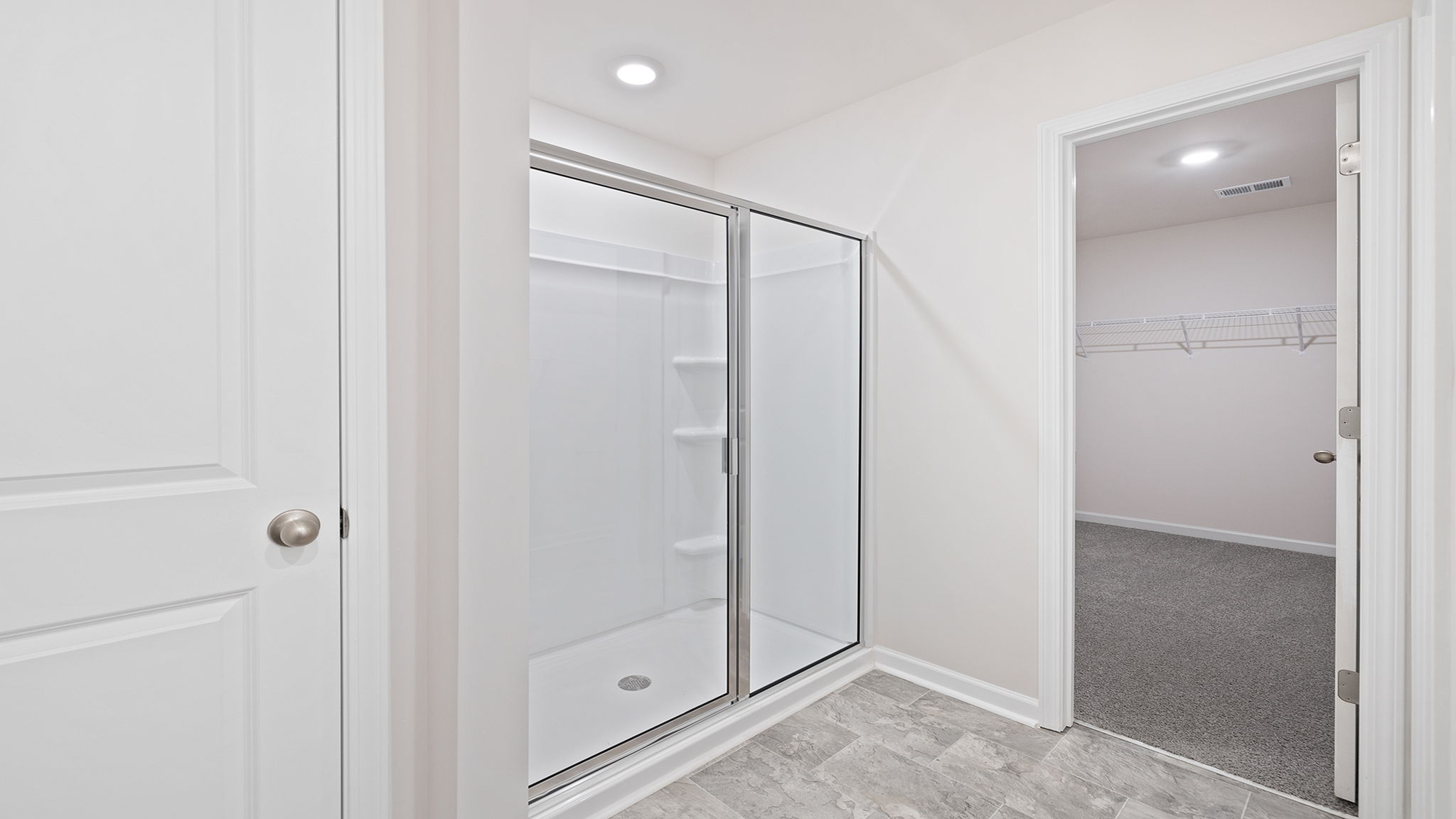 Primary bathroom with walk-in shower.
