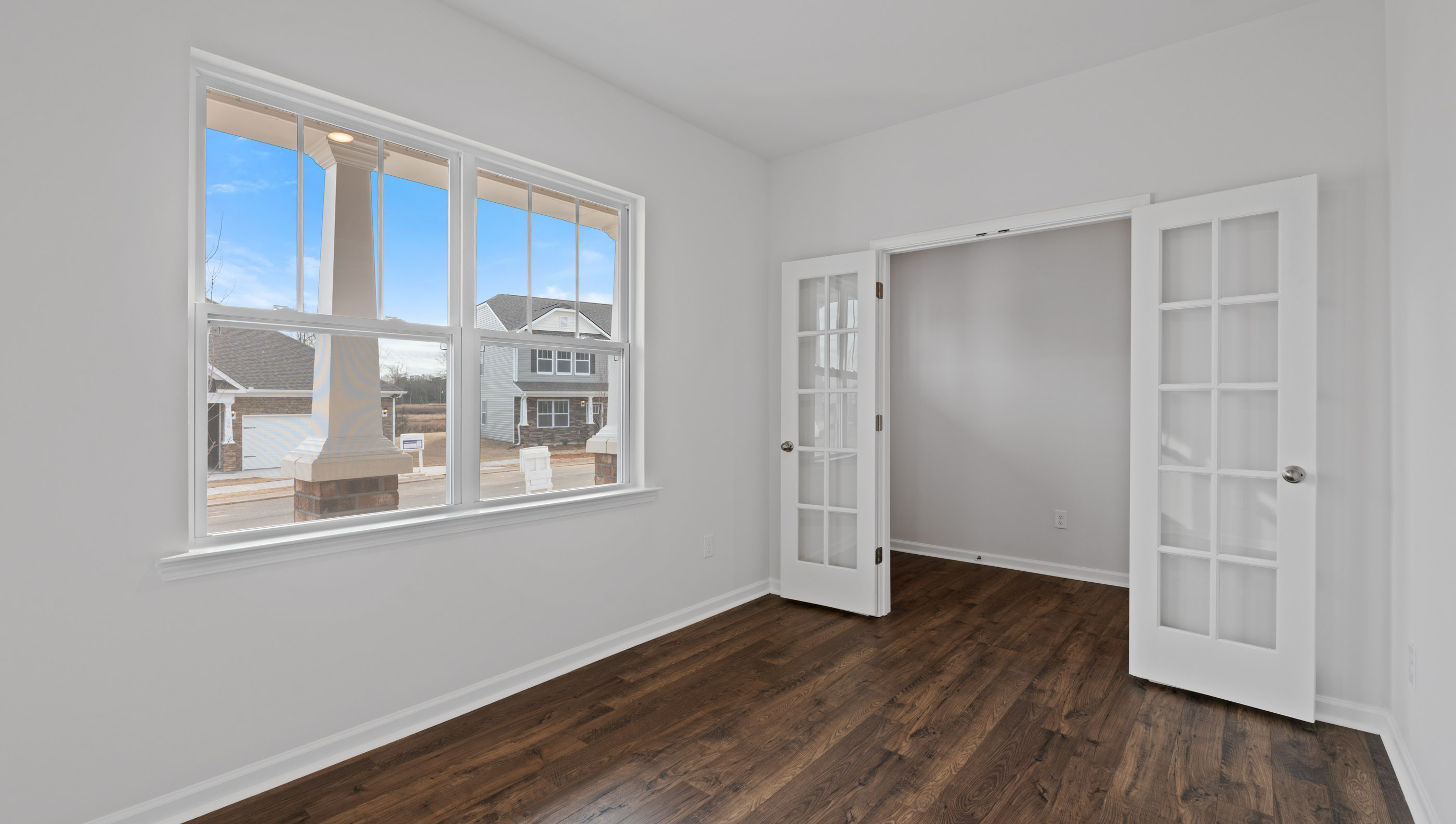 Study accented by French doors.