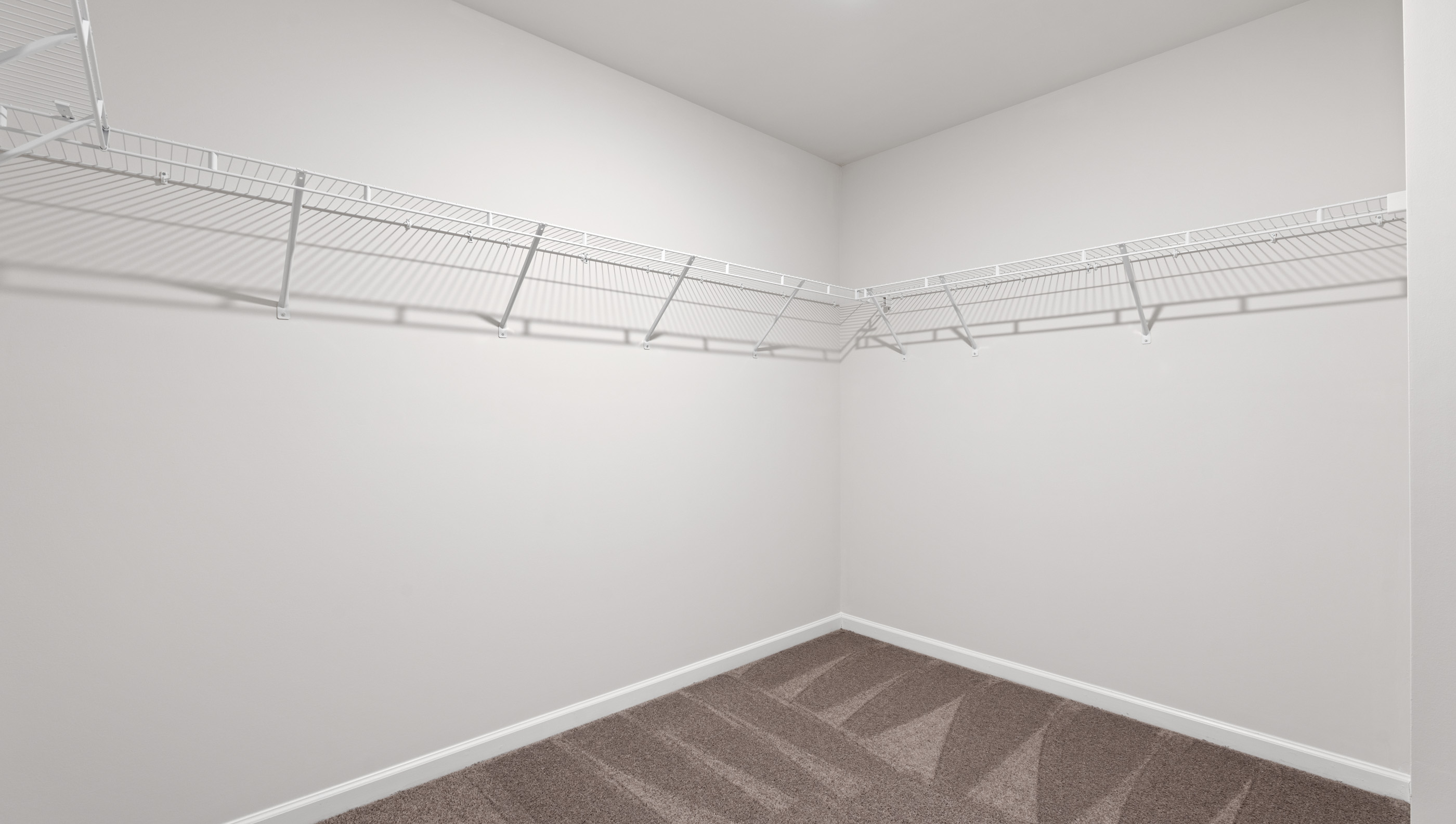 Primary bedroom walk-in closet.