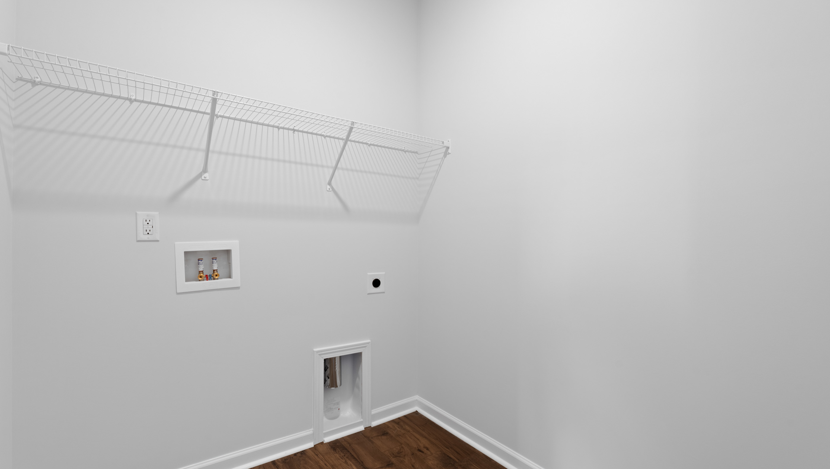 Laundry room with shelving.