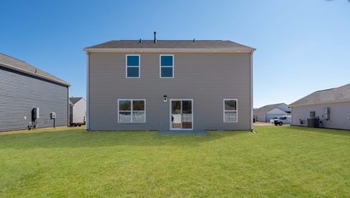 Back exterior of Penwell with large backyard.