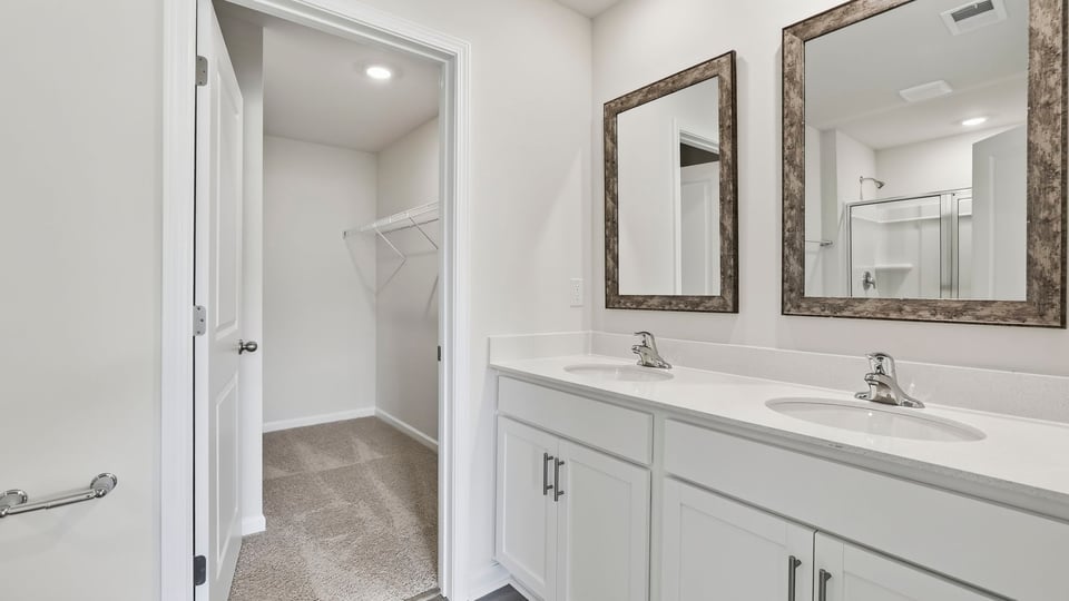 Primary bathroom with dual sink vanity.