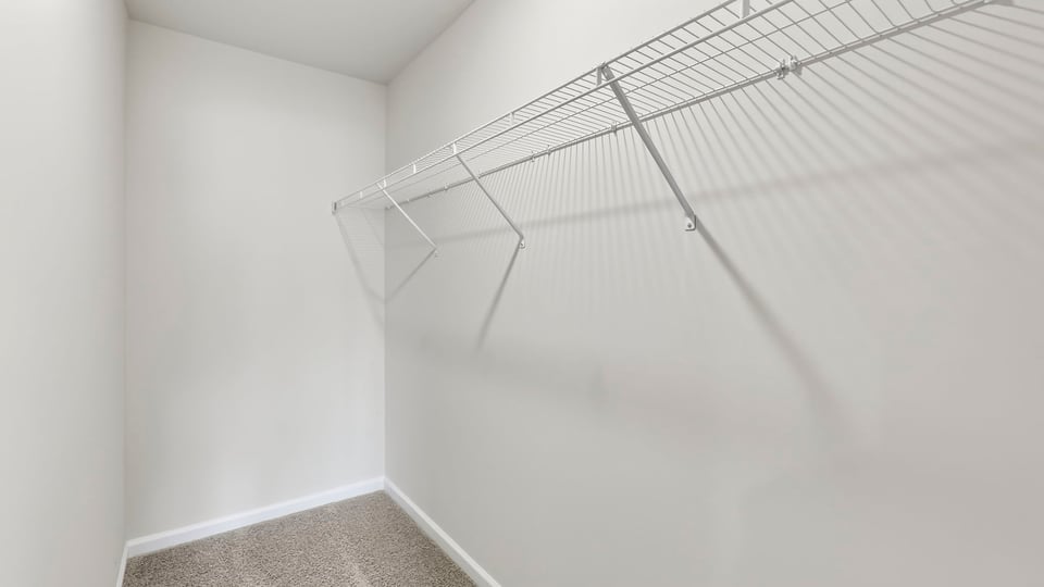 Primary bedroom walk-in closet.