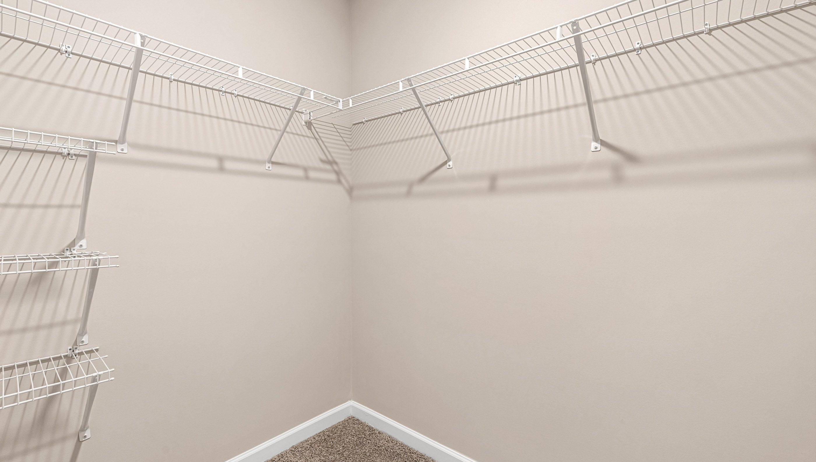 Closet with hanging storage racks.