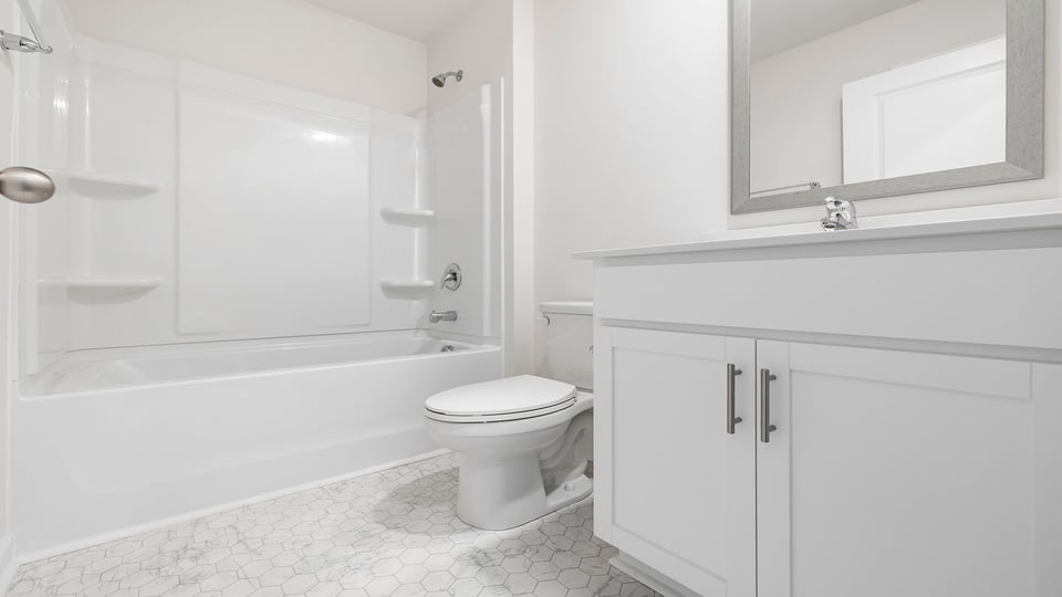 Bathroom with vanity and tub.