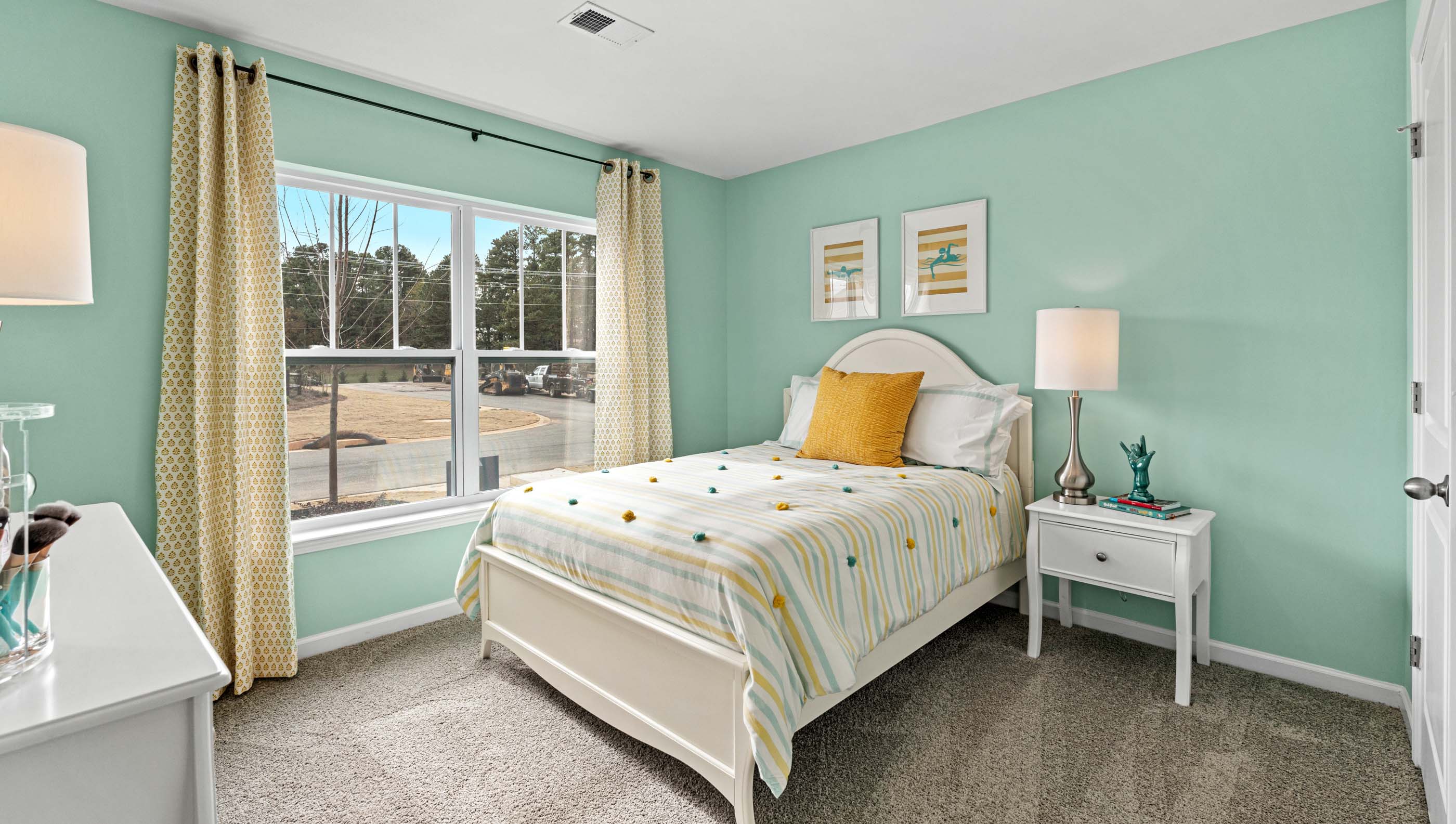 Bedroom with carpet and windows.