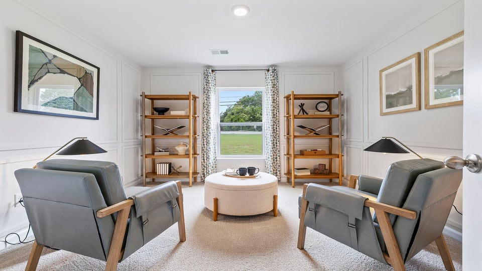 Bedroom with carpet and window.