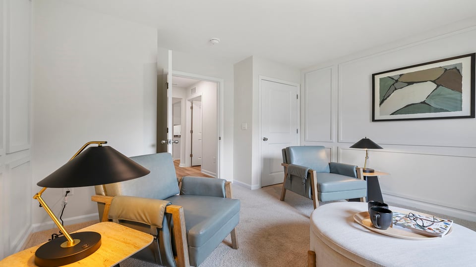 Bedroom with carpet and window.