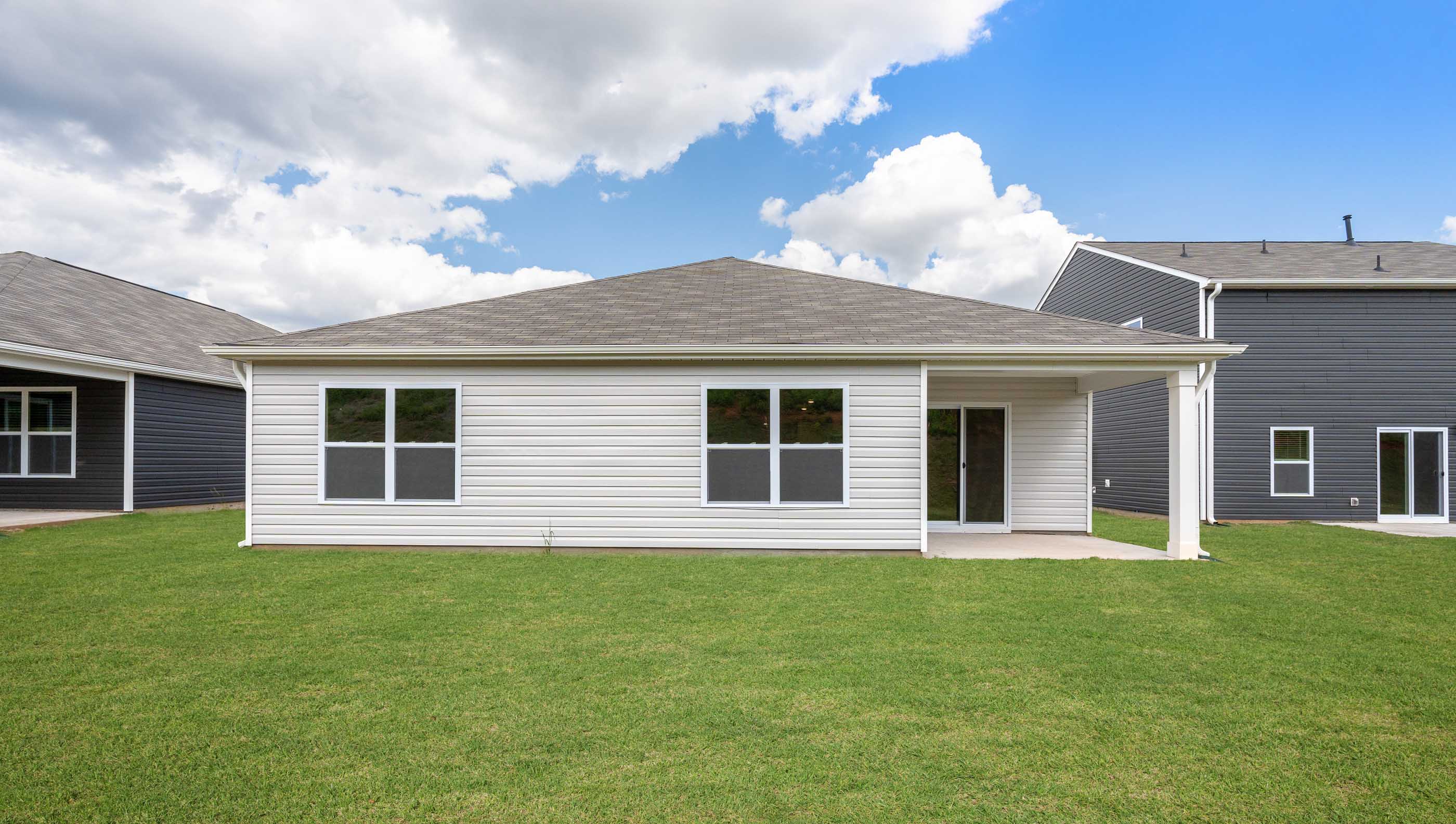 Back exterior with large backyard.