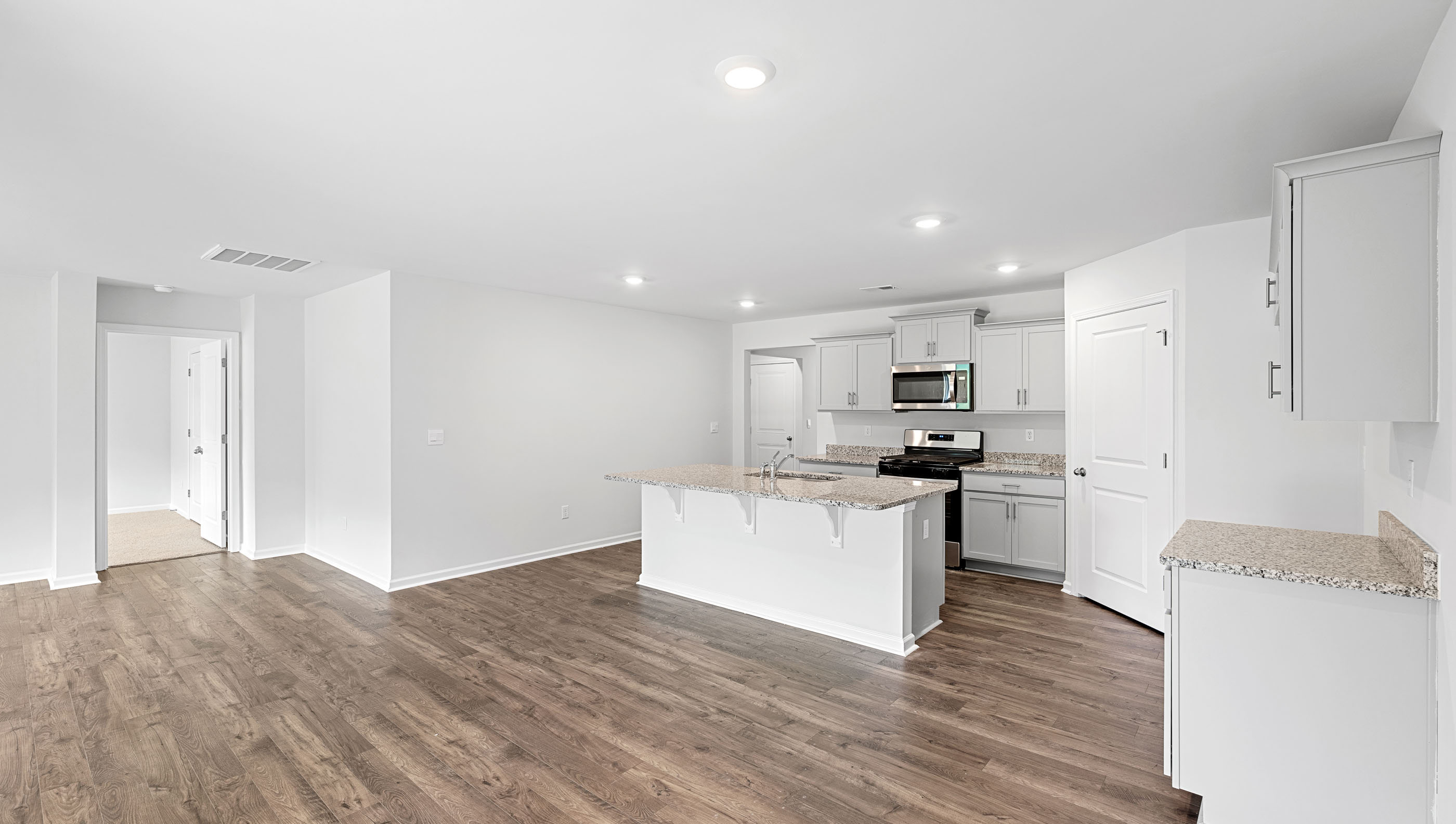 Kitchen with island and countertops.