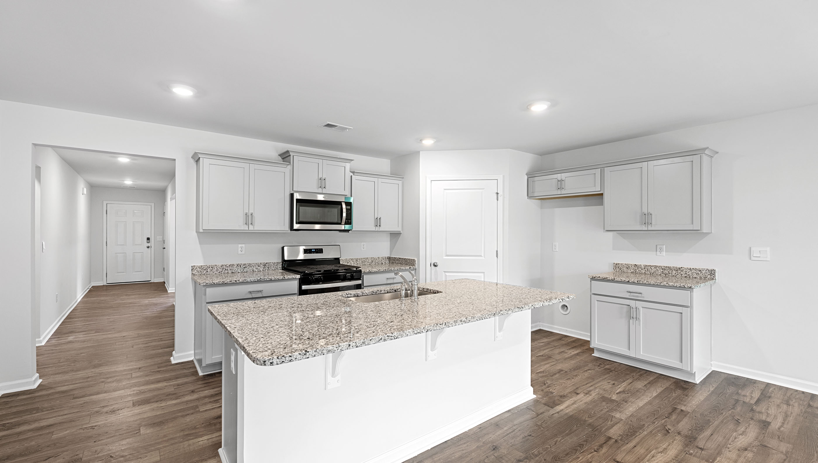 Kitchen with island and countertops.