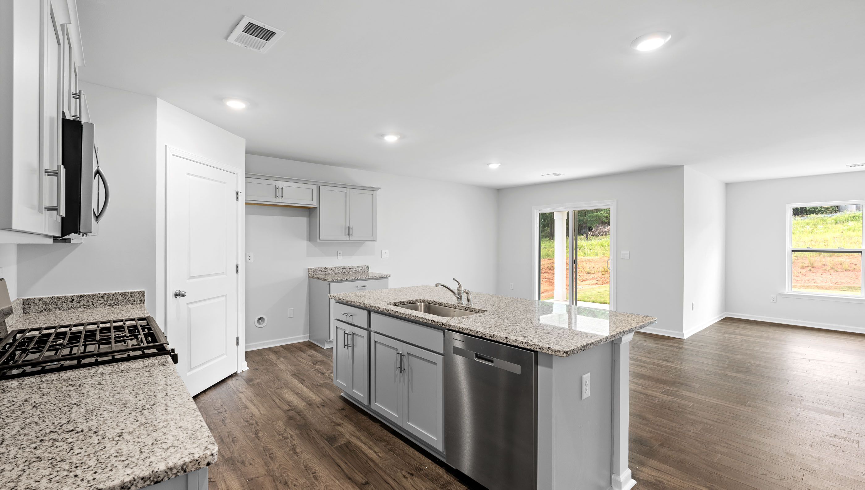 Kitchen with island and countertops.