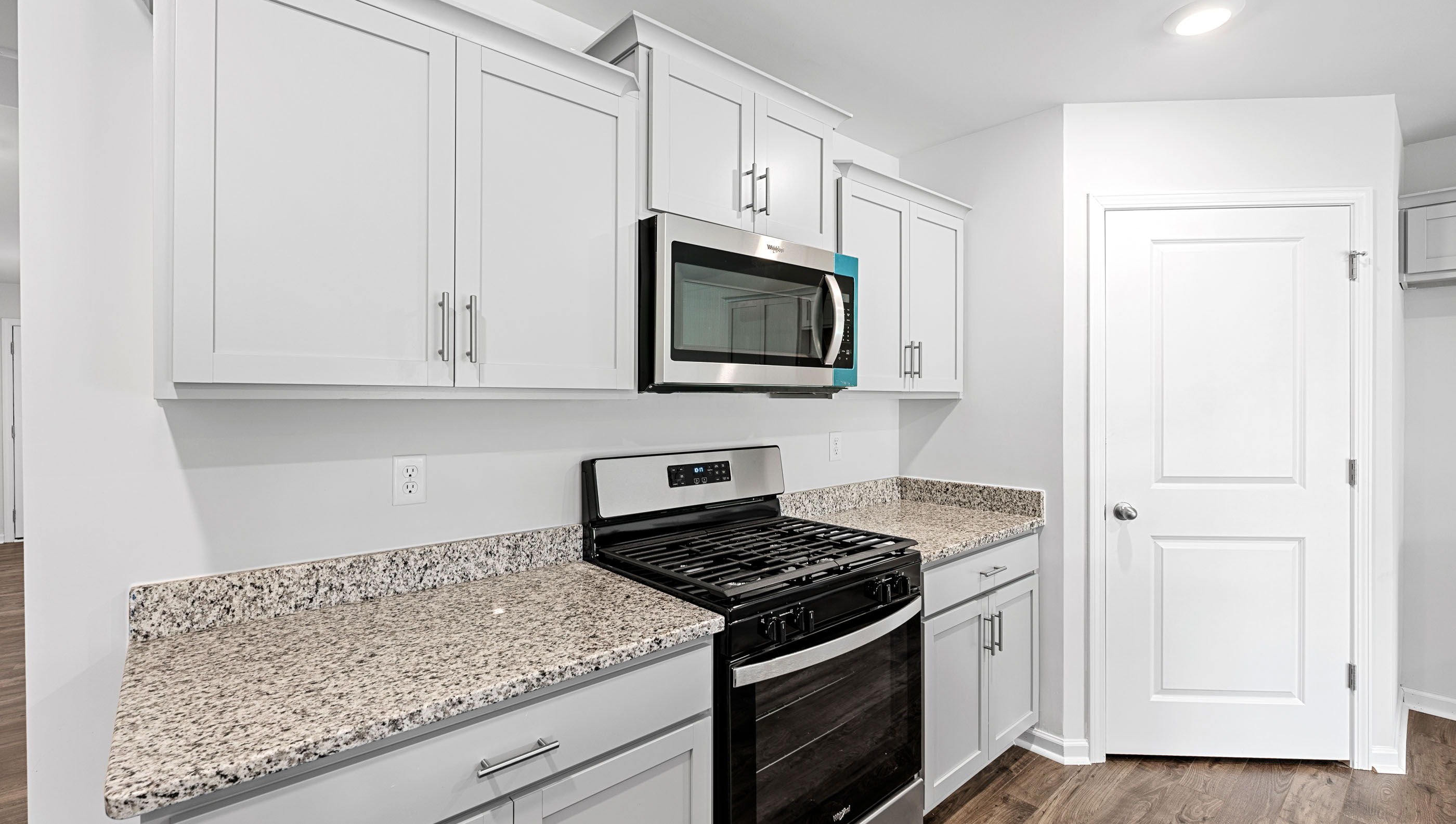 Kitchen with island and countertops.