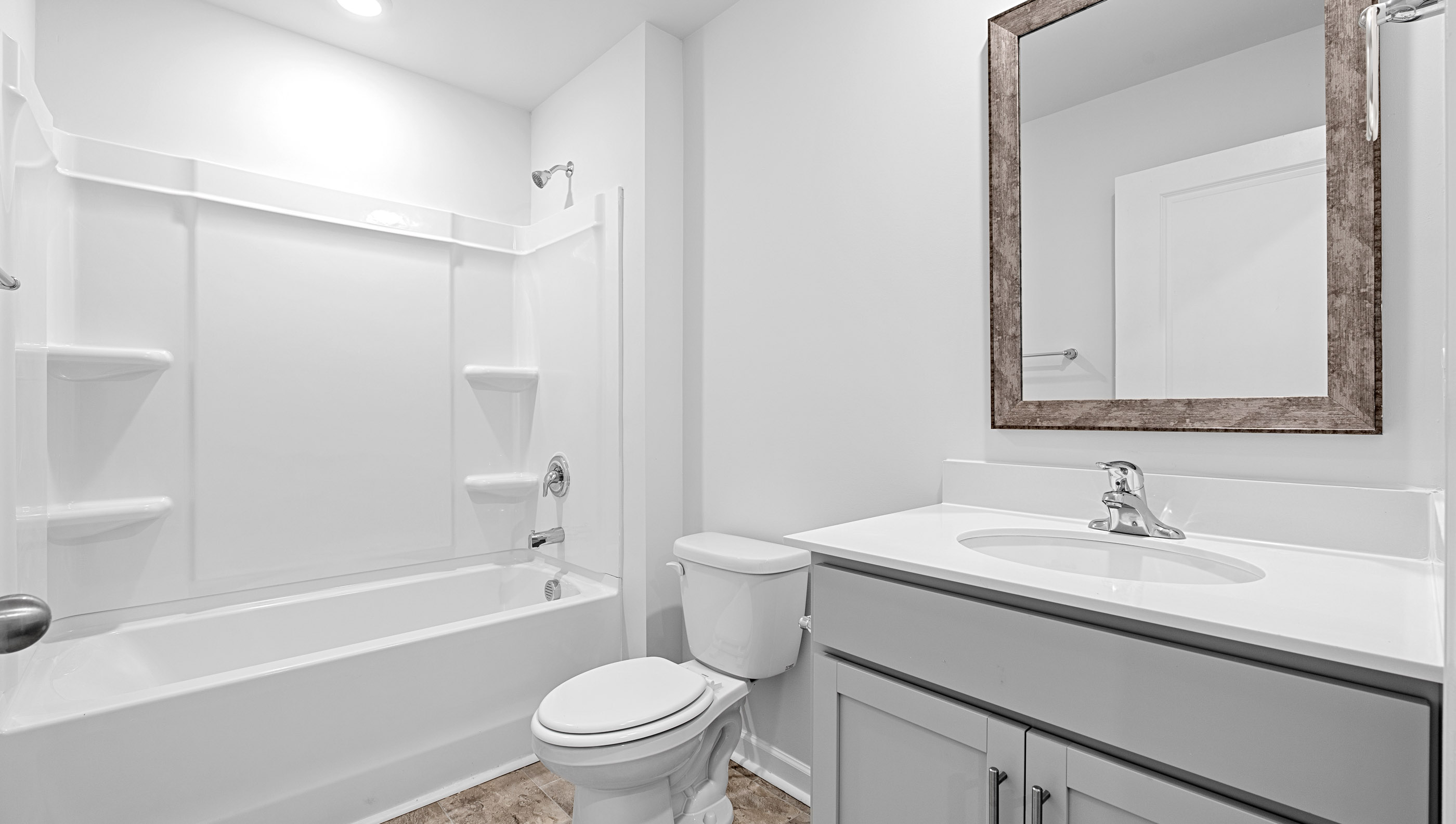 Bathroom with vanity and tub.